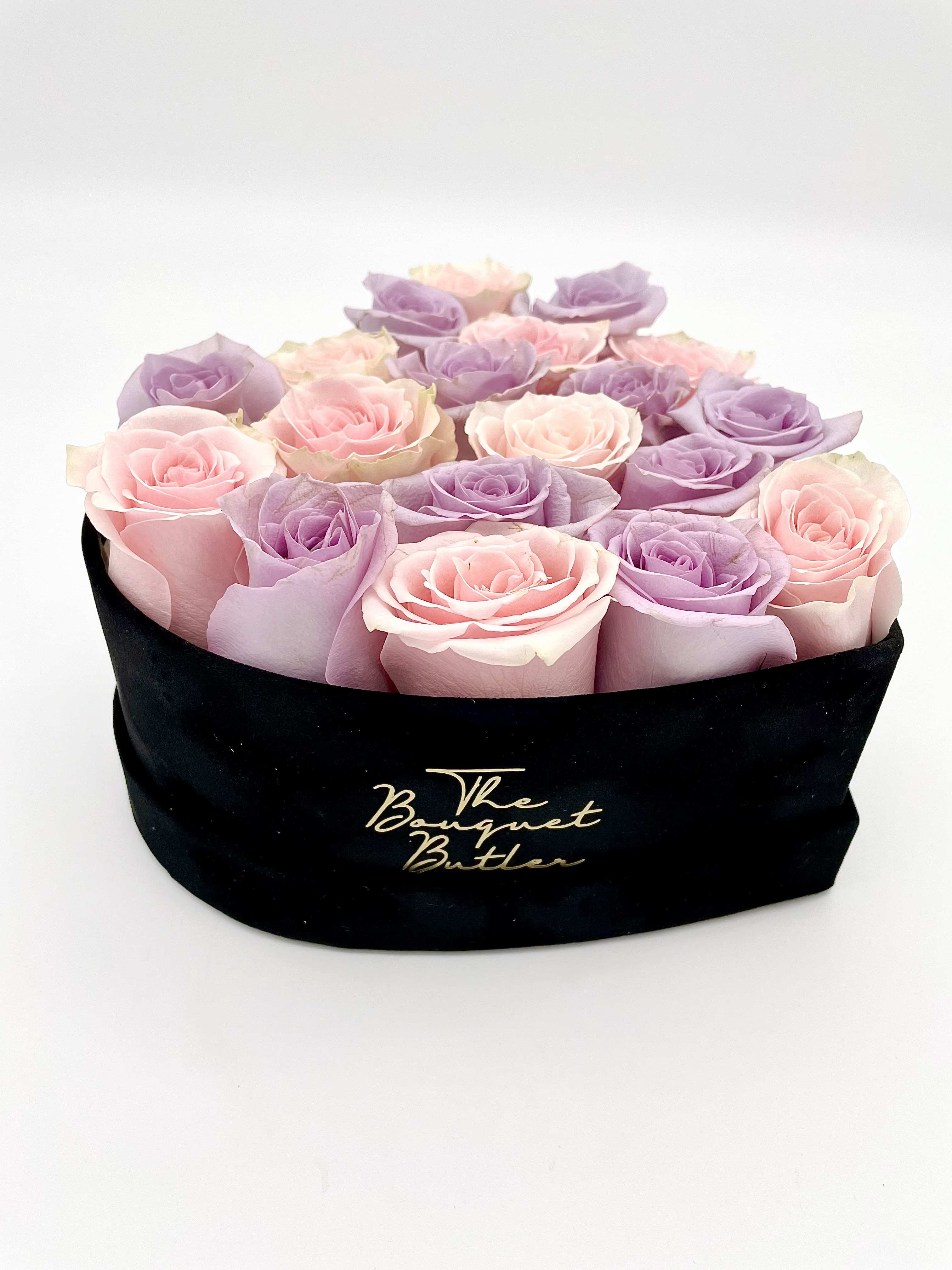 Soft Romance  - This arrangement captures the romantic, soft beauty of light pink and lavender roses in a velvet heart-shaped container.   Blooms are hand delivered in person to enhance any celebration or a “just because” surprise. Deliveries are done between 10am - 5pm. If the recipient is not home, we will leave the delivery if safe from the elements. We will call or text the recipient and let them know a delivery has been left.