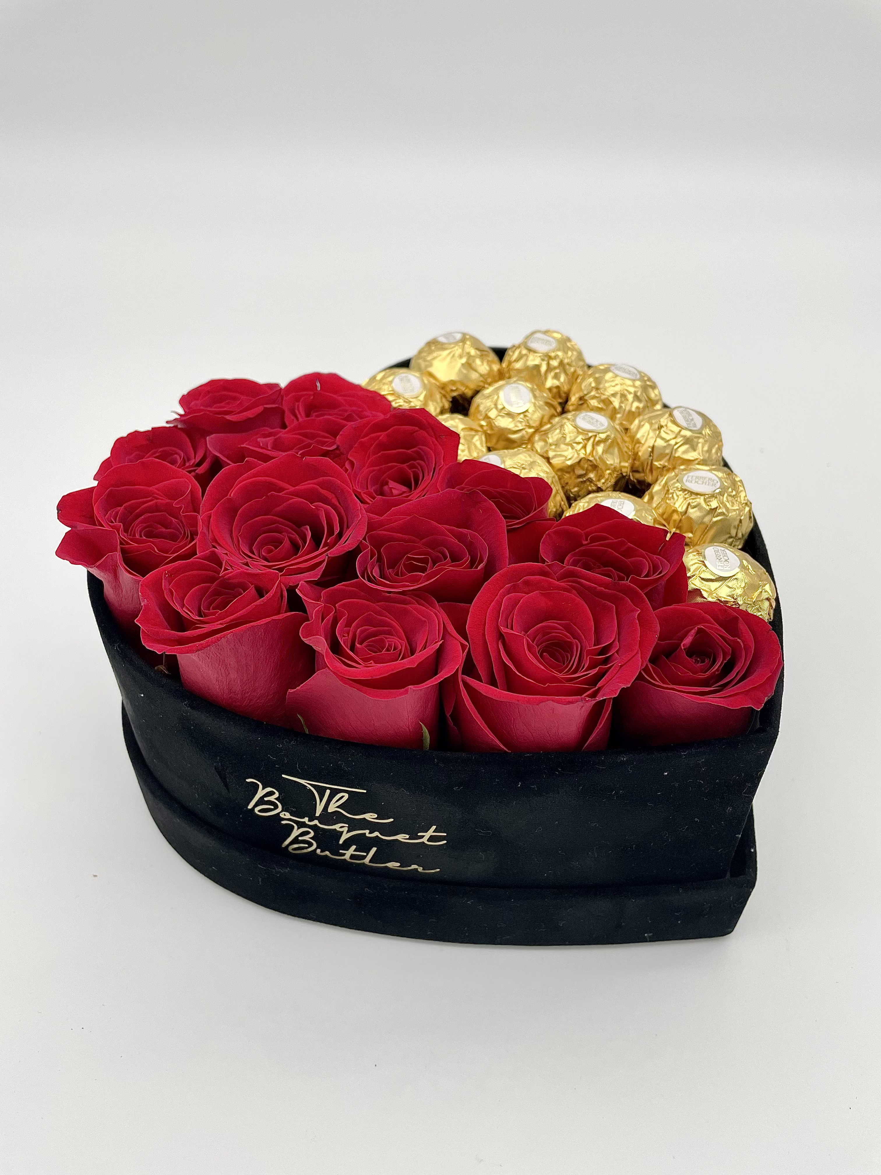 Velvet Love Story  - Show them a romantic gesture with this arrangement of red roses and chocolates in an elegant, black velvet heart.   Blooms are hand delivered in person to enhance any celebration or a “just because” surprise. Deliveries are done between 10am - 5pm. If the recipient is not home, we will leave the delivery if safe from the elements. We will call or text the recipient and let them know a delivery has been left.