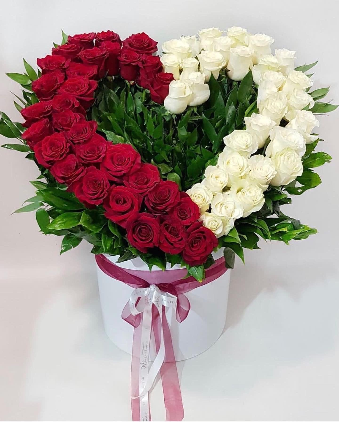 Heart in a Box - Heart shaped flower arrangement with white and red roses in a box. 