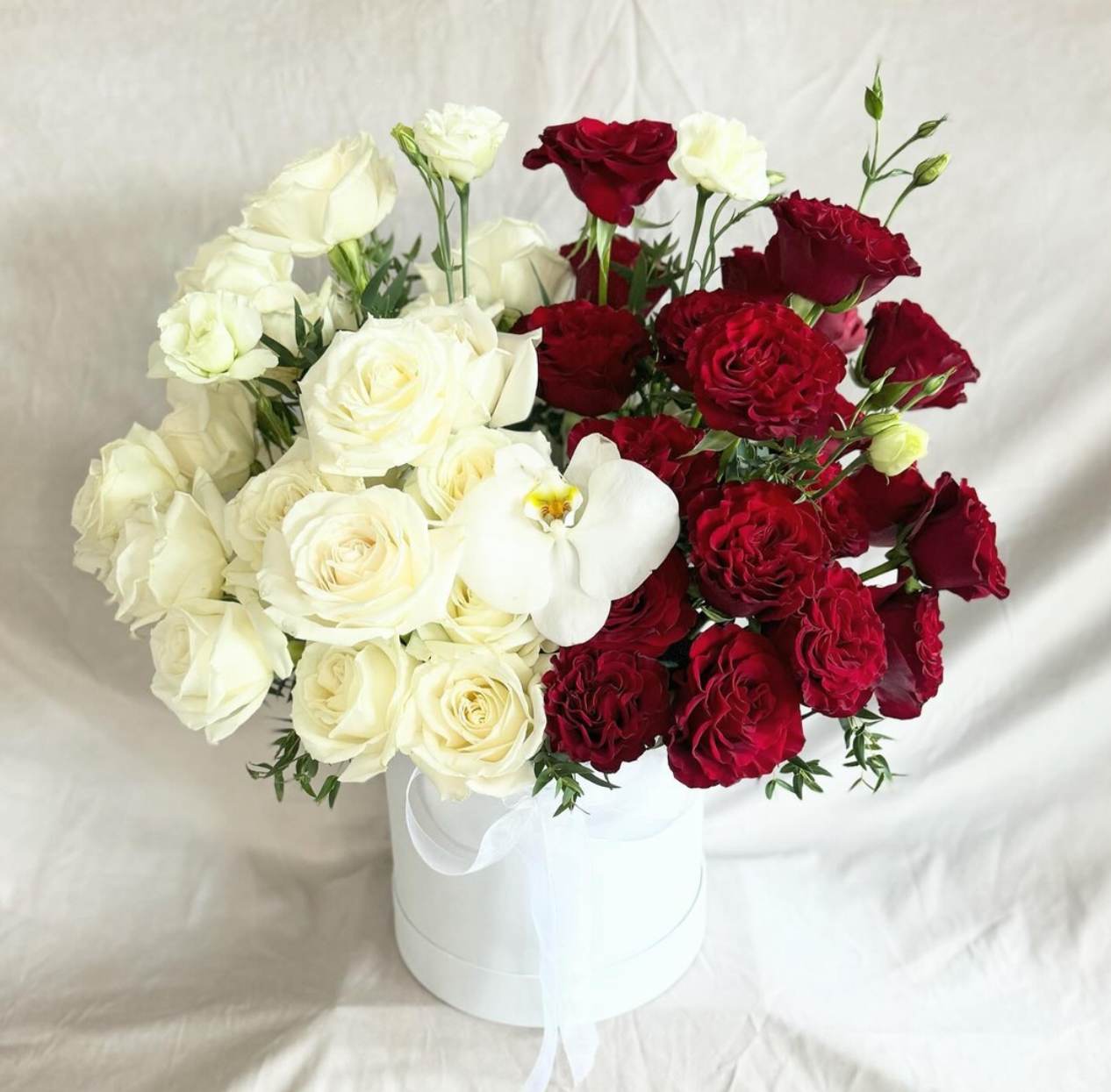 Box of Pure Romance  - White flower box filler with white and red roses with accent of white orchid. 