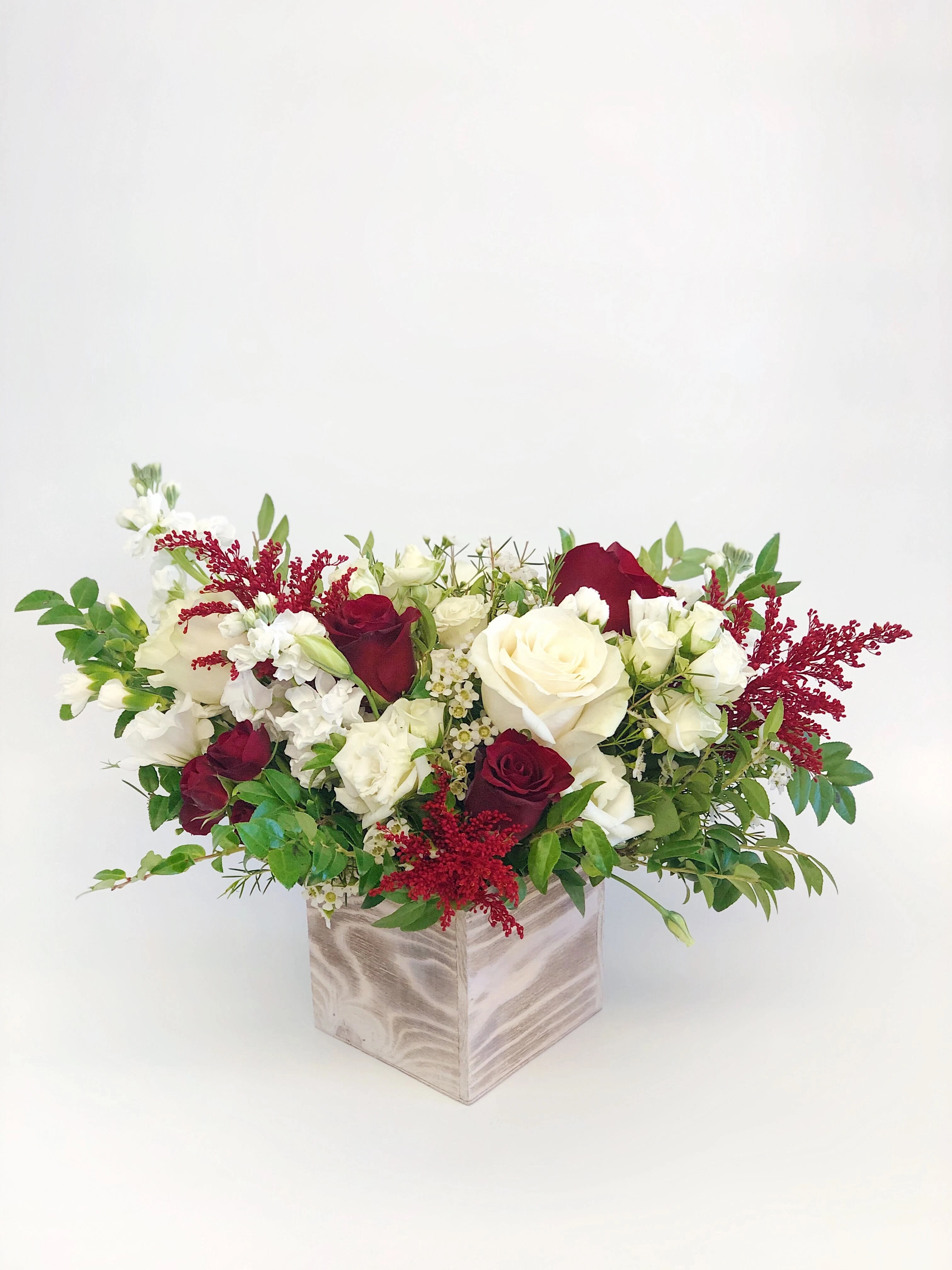 Red and White Flower Box - Mixed flower arrangement with red and white flowers in a box.