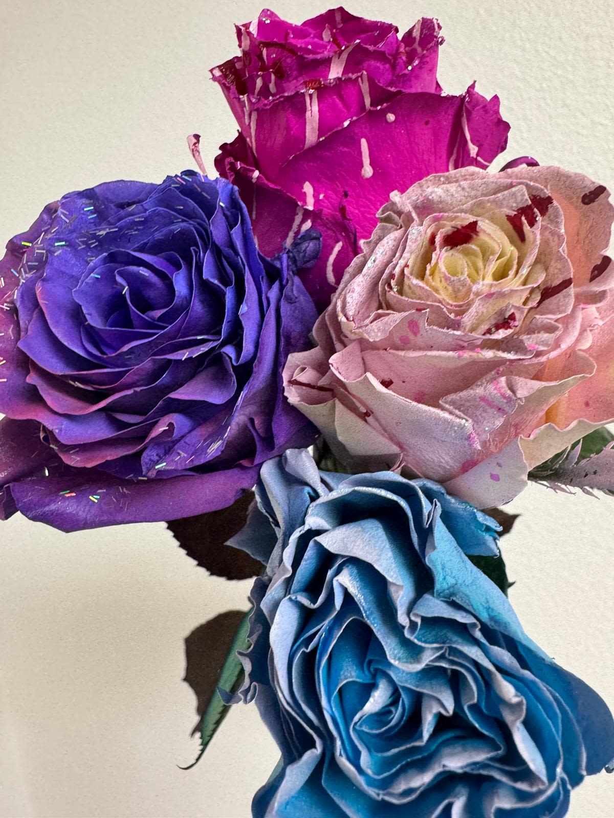 Enchanted Tones Floral – Tinted Roses Collection  -----Call us to order or leave the color layout in the special instructions!  - Choose from our luxurious tinted roses, available in stunning color options and customizable arrangements in sizes of 12, 18, 24, 36, 48, or even 100 roses for a truly breathtaking display.   Available Tinted Rose Colors: Blush Pink – Soft, romantic, and timeless. Royal Blue – Bold, vibrant, and striking. Lavender Dream – Elegant with a touch of mystique. Hot Desire Pink rose– A radiant, luxurious statement.   Design Options:  12 Roses – A chic, elegant bouquet for an intimate gift.  18 Roses – A beautifully balanced arrangement for any special moment.  24 Roses – A stunning display of love and admiration.  36 Roses – A grand bouquet for an unforgettable impression.  48 Roses – A luxurious arrangement for upscale events or romantic gestures.  100 Roses – The ultimate statement of love and elegance, perfect for milestones and extravagant celebrations.    Pick any combination of colors to create a custom, one-of-a-kind design! Whether you want a monochrome statement or a dreamy blend of hues, we’ll craft a bouquet that’s uniquely yours.   Available for same-day delivery  Order now and bring a touch of enchantment to any occasion!