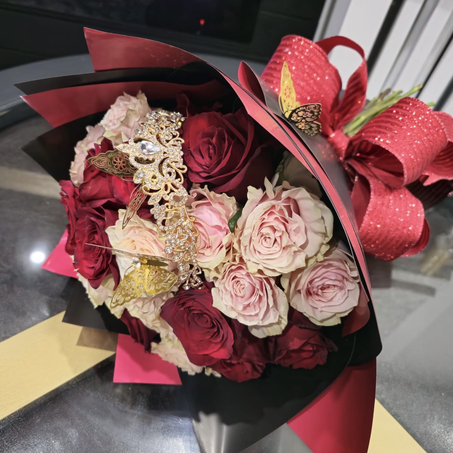 Stacie's Royal Bouquet Stacie's Royal Bouquet - Beautifully hand crafted bouquet with 25 Roses. Treat that special someone like royalty with this beautiful bouquet. *** Rose color can be substituted upon request***