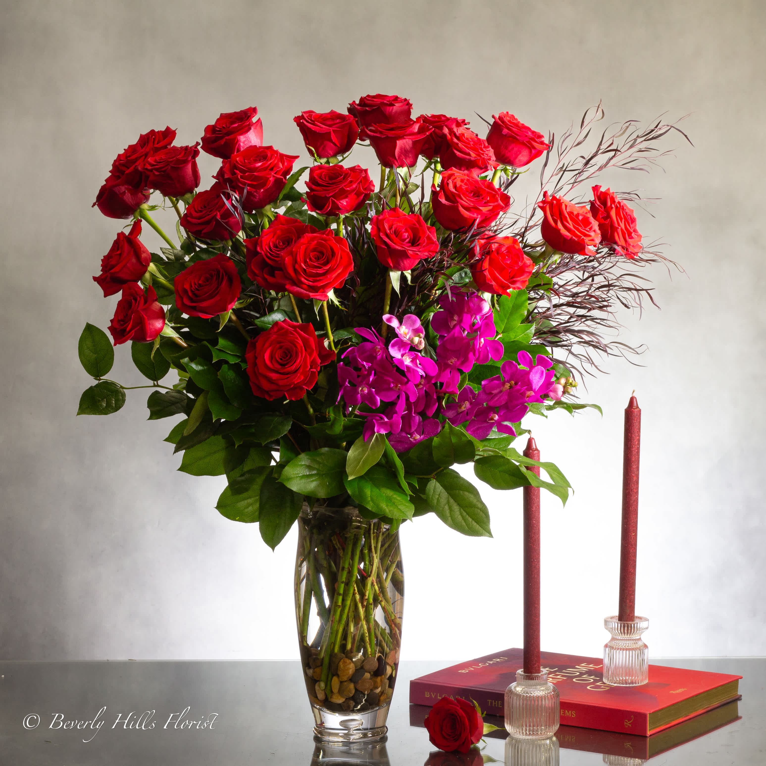 Red Velvet - Valentines Edition - Because your love deserves a gift twice as romantic, send this fresh and fabulous arrangement of two dozen red roses beautifully arranged in a classic glass vase. Our Red Velvet arrangement is a wonderful way of letting someone in your life know they are important to you and you appreciate all the love they give.  32&quot; Tall and 28 Wide   Deluxe: Includes 36 red roses   Premium: Includes 50 red roses   