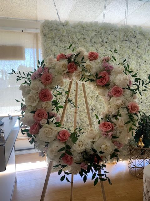 Graceful Pink & White Floral Wreath Graceful Pink & White Floral Wreath - A timeless symbol of love, remembrance, and peace, this Graceful Pink & White Floral Wreath is a beautiful tribute to honor a loved one. Featuring a delicate blend of soft pink and white roses, hydrangeas, and lush greenery, this standing wreath offers a heartfelt expression of sympathy and admiration.