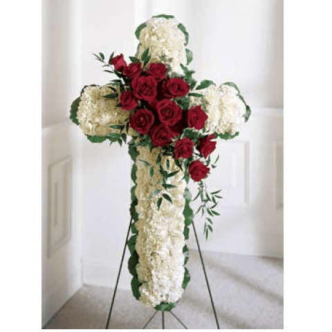 Cross on Easel Cross on Easel - White carnations and red roses are designed into this religious floral display. Appropriate to send to the funeral home. Arrangement is delivered with an easel for display. SKU#: S9-3160