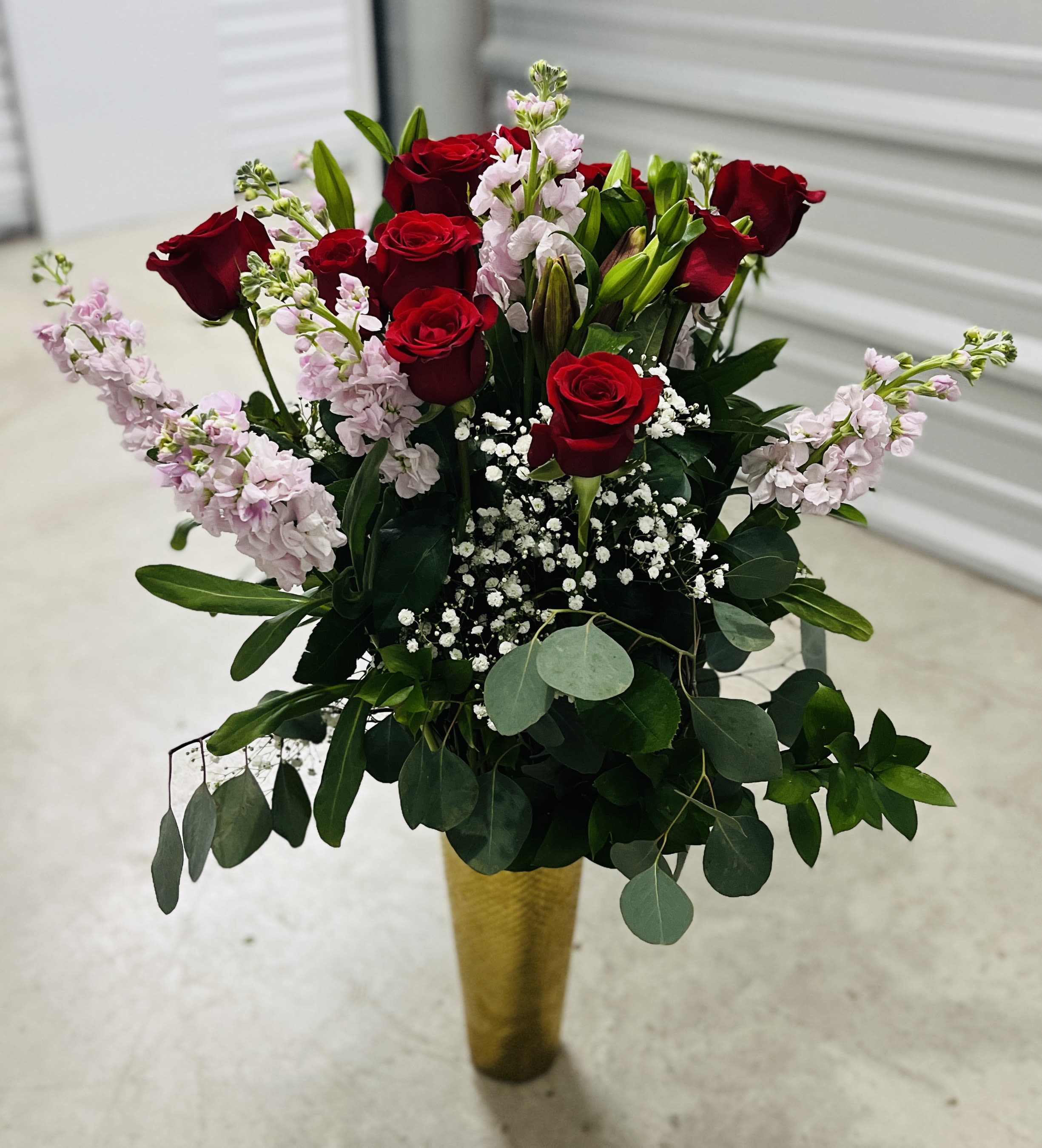 the grand roses - 1 dozen roses with baby breathe in a gold vase, eucalyptus ruscus and stock; extra tall!!