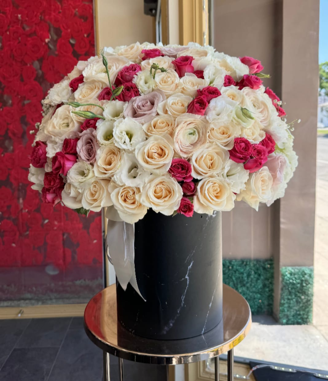 Cherry blossom - Brighten any space with our Elegant Flower Box Arrangement! Bursting with vibrant blooms, this stunning display combines seasonal favorites with lush fillers.   Housed in a chic, reusable container, it makes a perfect centerpiece for any occasion be it a gift or a treat for yourself. Elevate your decor with this captivating arrangement that brings joy and sophistication to your home or office. Order yours today and let the beauty of flowers inspire you!