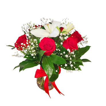 SMALL VASE WITH RED ROSES - SMALL VASE BOUQUET.  Flower Stems: 6 Red Roses, 1 Lily Stem, Baby's Breath, and Assorted Greenery The floral arrangement is designed in a clear glass vase with water.