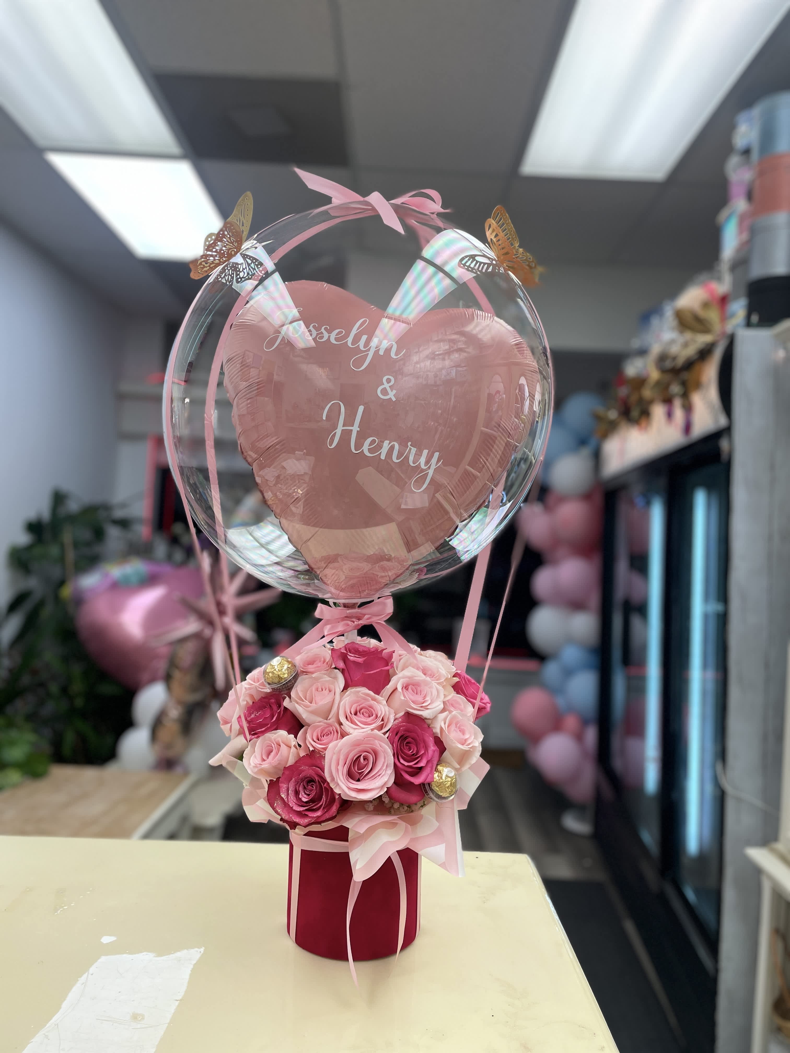 Cotton Candy  - Arrangement with 18 roses to choose in a circle box lined velvet red with a customize ballon  Measure box 7 x 6 inches (Medium)