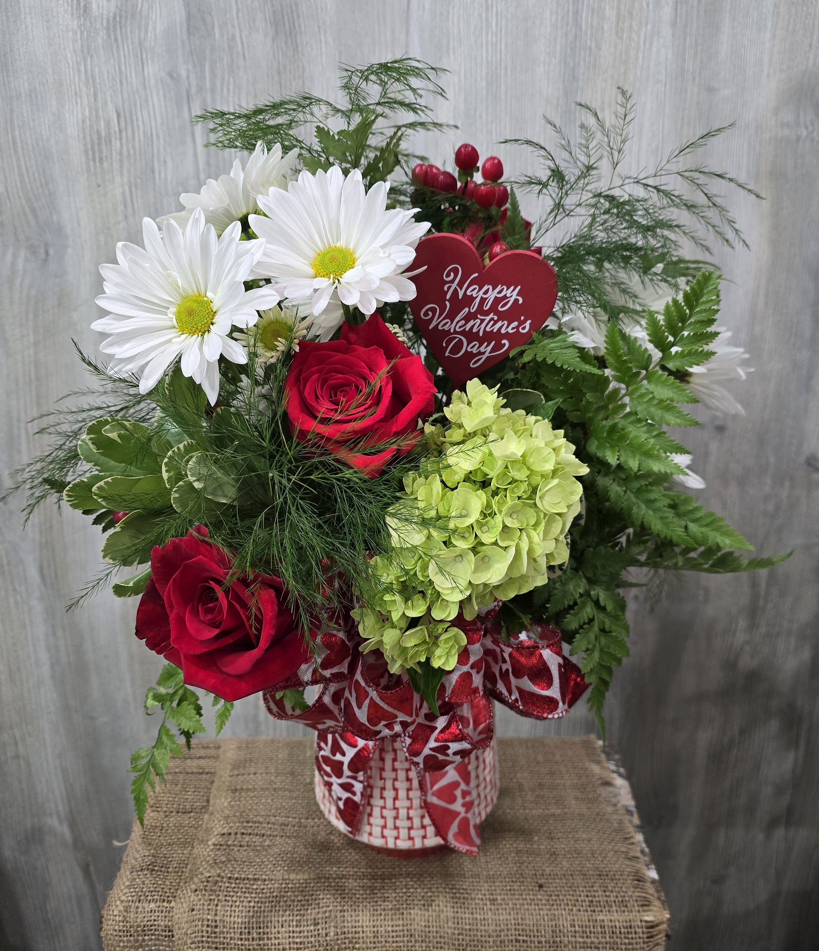 Humble Love  - A beautiful mixture of garden colors and red roses. Deluxe and premium prices include more flowers. 