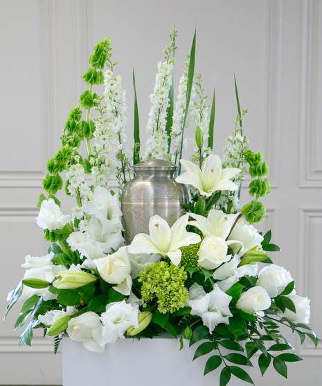 Heavenly Surround Heavenly Surround - This urn surround is a stunning memorial to surround a loved one's urn at a funeral or Celebration of Life Ceremony. A classic design that can be easily customized to your color preference. The Heavenly Surround features seasonal flowers and mixed greenery. Due to the current situation, supply is limited, therefore, color and variety substitutions of flowers or container may be necessary, please specify if you have a preference and we will do our best to accommodate your request.