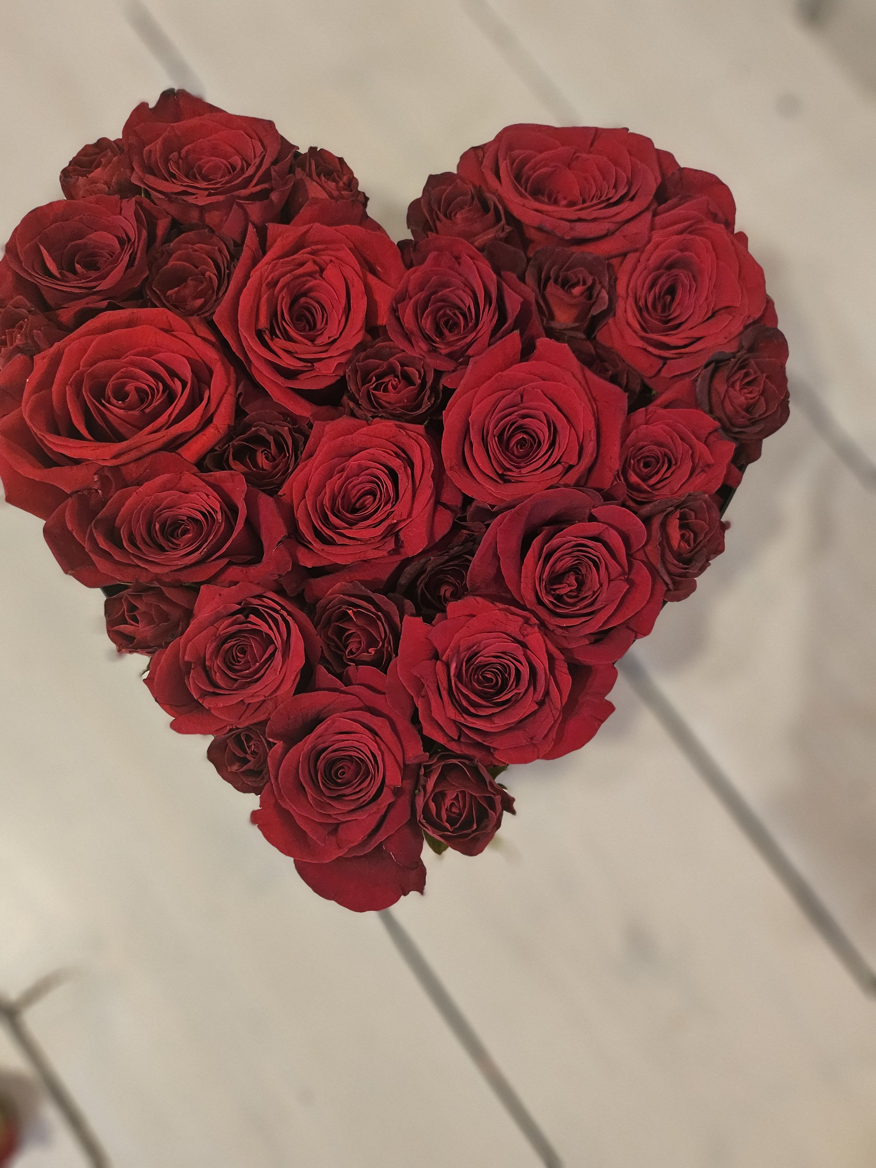 Heart Box - This heart shapped box is filled with 28-30 roses, and 15 spray roses for deepth. Its elegant and clean design is perfect for all those rose lover out there.