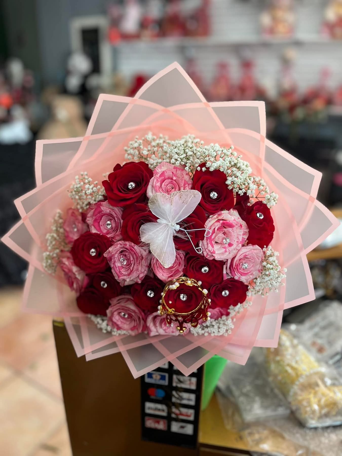 Ramo buchon Ramo buchon - Beutiful bouquet with Rosa’s crow and butterfly 12 stems $55.00 24stems $99.00 36 stems. $ 185.00