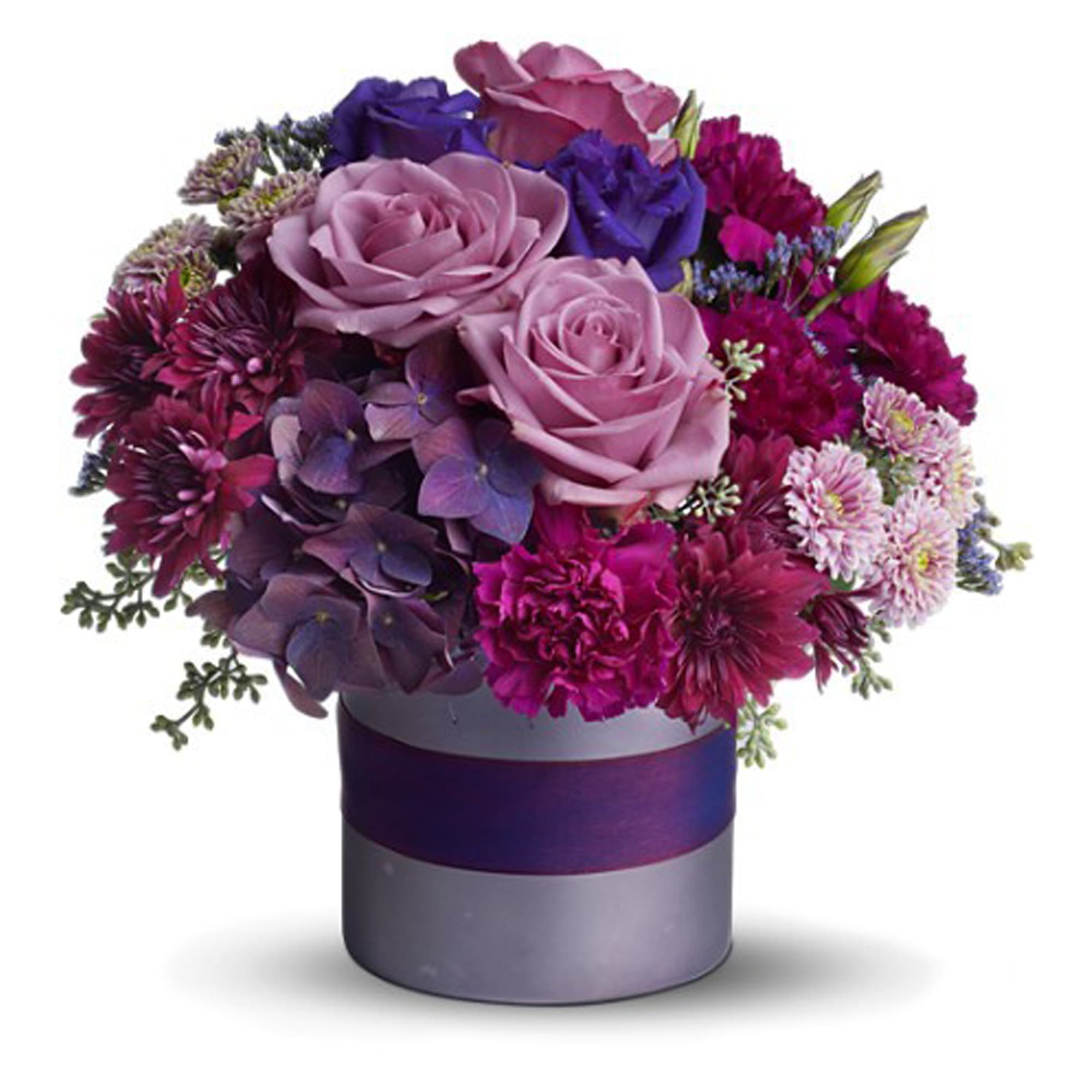 Teleflora's Truly, Madly, Deeply - Teleflora's Truly, Madly, Deeply is all about love at its loveliest. Surprise your sweetheart with this gorgeously romantic bouquet and she'll love youâ¦ well, you know.    The stunning bouquet includes lavender roses, purple carnations, purple hydrangea, purple lisianthus, lavender cushion spray chrysanthemums, purple cushion spray chrysanthemums and limonium accented with fresh greenery. The flowers are delivered in a satiny lavender cylinder vase decorated with a lavender satin ribbon. Bouquet is approximately 13â W X 13â H. This item is hand-arranged and delivered by a florist.    Orientation: All-Around    As Shown : 08N380B