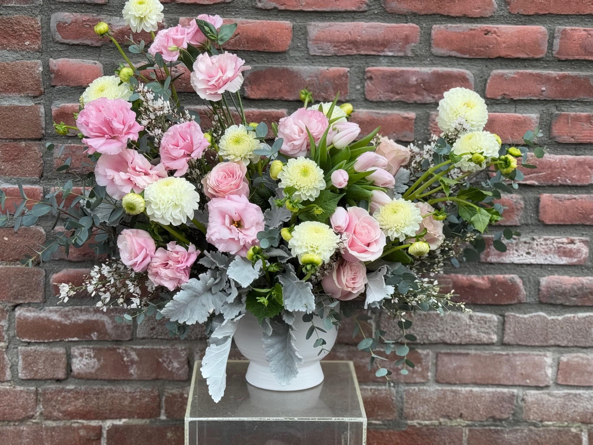 Sierra - Composed of Roses, spray roses, tulips, variety of green.