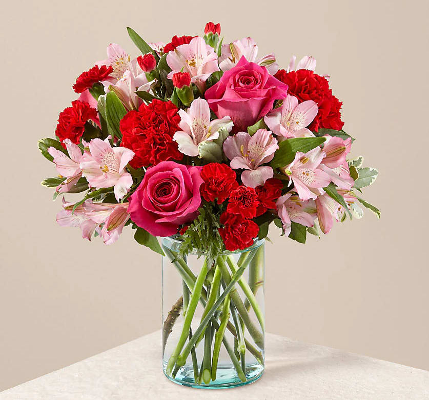 Pretty Pink - This bouquet is abundant with a classic assortment of pretty florals – roses, alstroemeria and carnations to name a few.