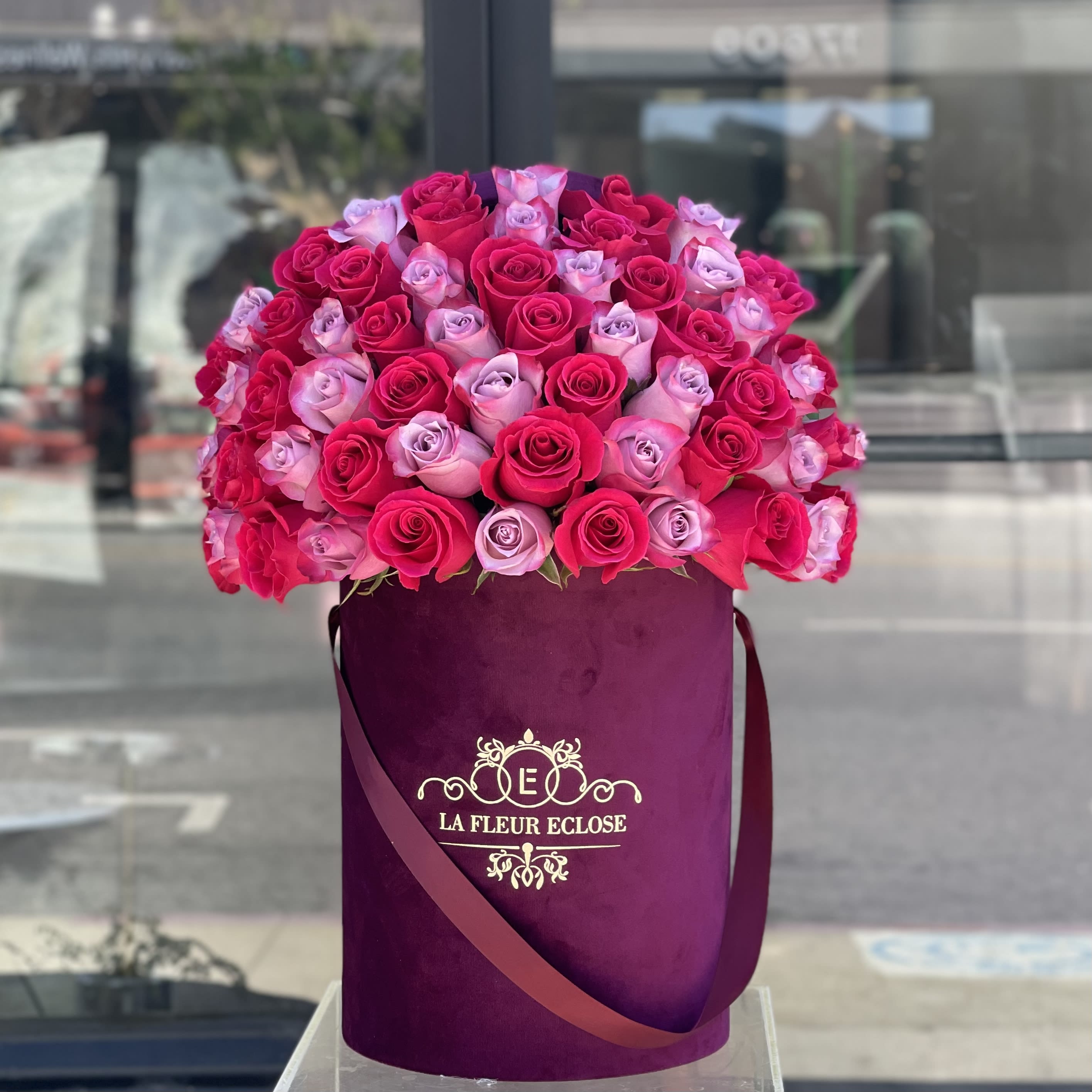 Burgundy pleasure V - Fresh deep purple and hot pink roses in a velvet burgundy box Standard - 50 roses Deluxe - 75 roses Premium - 100 roses