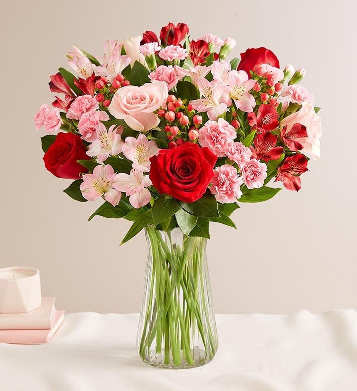 Expressions of Love Expressions of Love - True love, expressed through flowers. We've gathered a mix of blooms in romantic shades of red and pink for a Valentine's gift that speaks volumes about how you feel. True love, expressed through flowers. We've gathered a mix of blooms in romantic shades of red and pink for a Valentine's gift that speaks volumes about how you feel. Single or double mixed bouquet of red and pink roses, red and pink Peruvian lilies (alstroemeria), red hypericum, and pink mini carnations (shades of pink may vary)Picked fresh on our premier farms around the world, our flowers are cared for every step of the way and shipped fresh to ensure lasting beauty and enjoyment. Exclusive crystal vase with a classic, stylish design; measures 9" height.
