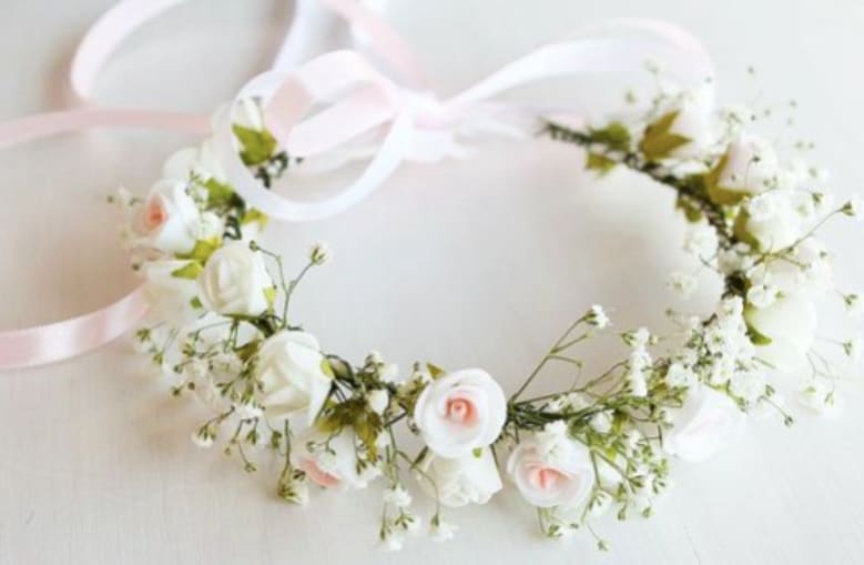 Floral Crown Floral Crown - Child's Floral Crown - perfect for First Communions, Special Events, and Weddings. Adjustable 10-14" crown with Babies Breath, Spray Roses, and fillers. Connected ribbons in various colors, prepared at 24" long. Customer cuts to proper length on child.