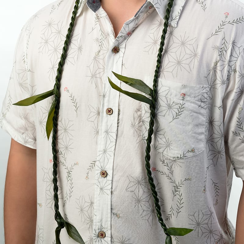 Hawaiian Ti leaf Lei, Classic Single - Our hand-crafted Ti Leaf lei is perfect for congratulating and sending happy wishes to anyone in your life! Made with care and attention to detail, this lei embodies the spirit of celebration and well-wishing.   Key features include:  Hand-Crafted Quality: Each lei is meticulously hand-crafted, ensuring a unique and high-quality product.  Versatile Gift: Suitable for any occasion, from graduations and birthdays to anniversaries and promotions.  Symbol of Good Wishes: The Ti Leaf is traditionally known for its significance in bringing good luck and positive energy.  Fresh and Local: Made with fresh, locally sourced Ti leaves for the best quality and longevity.  Local Delivery: Please note a minimum spend of $30 is required for local delivery (excluding delivery costs).  Celebrate and send happy wishes with our beautiful hand-crafted Ti Leaf lei, a perfect gesture for any special moment.  