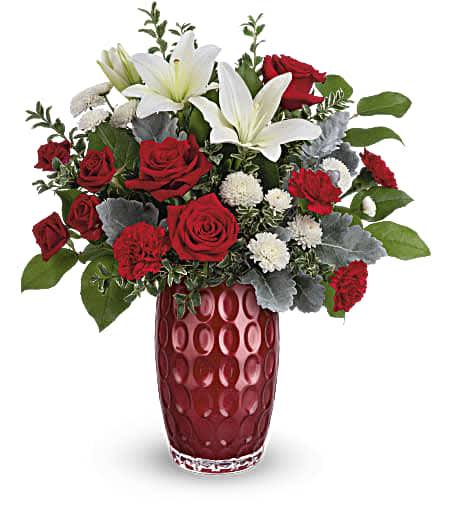 Teleflora's Love In Style Bouquet - Put a stylish spin on your Valentine's Day sentiments with this chic rose and lily bouquet, artfully arranged in a pearlescent glass vase with eye-catching, contemporary pattern.
