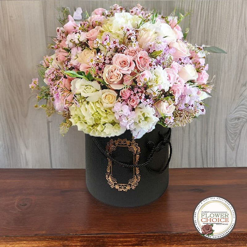 Garden Serenity - Find tranquility amidst the chaos with Garden Serenity. Delicate pastel roses and dreamy hydrangeas are nestled amidst fresh greens and dainty fillers in this delightful box. Perfect for bringing a touch of serenity and calmness to your loved one's day.