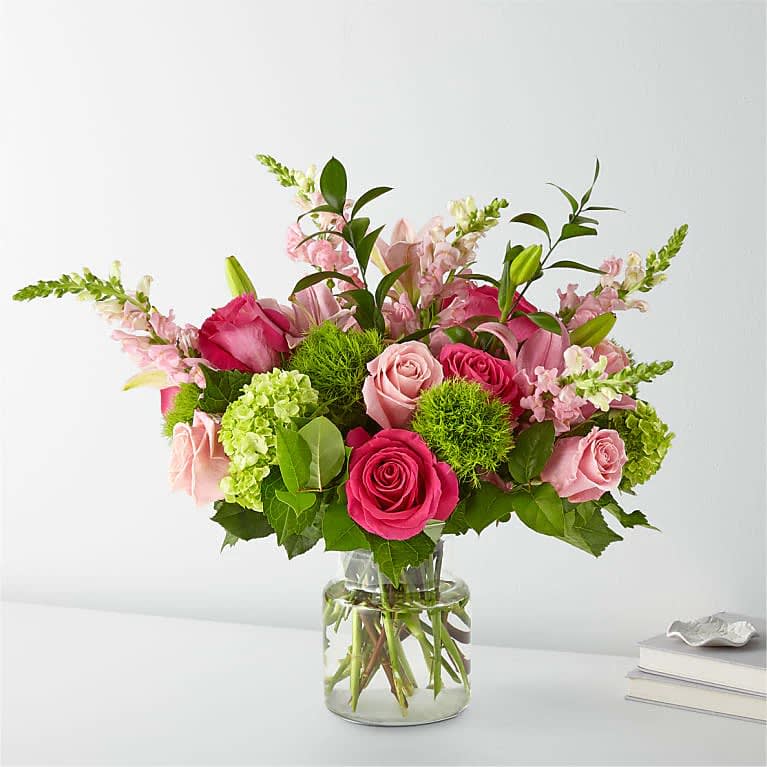 Once Upon A Time - Looking to add some color and cheer to your next event? Look no further than our stunning and vibrant modern floral arrangement! Expertly crafted using only the freshest blooms, this arrangement is sure to impress and make a statement. Perfect for any occasion, from birthdays to weddings, our colorful and lively design will bring a sense of joy and celebration to any setting. So why settle for ordinary flowers when you can have something truly extraordinary? Order now and let our expert florists bring your vision to life with our stunning and unforgettable floral creation.