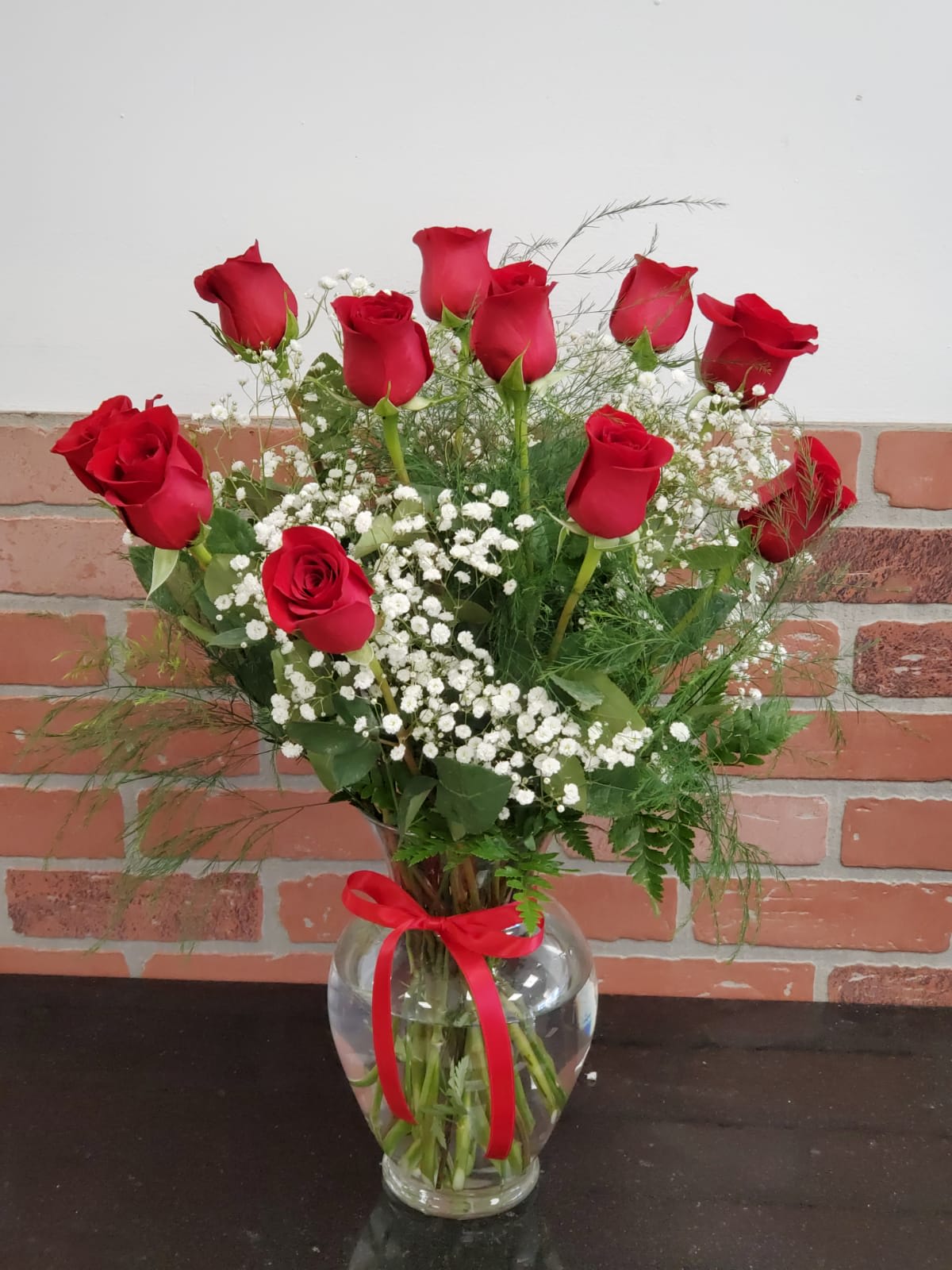 Dozen Red Rose's in a vase with baby breath - Red Rose's in a vase always make someone happy they came 3 size like the picture 12 Rose's  Medium 18 Rose's Large 24 Rose's 