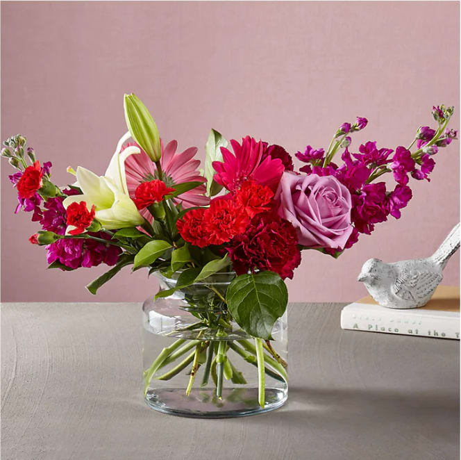 All My Love Bouquet - Give everything and more to the one who captured your heart. The All My Love Bouquet features refreshing pops of color in the hot pink gerbera daisies, while the crisp lilies in a clear, glass vase are effortlessly timeless and elegant.  Please Note: The bouquet pictured reflects our original design for this product. While we always try to follow the color palette, we may replace stems to deliver the freshest bouquet possible, and we may sometimes need to use a different vase. DETAILS The Premium Bouquet is about 17&quot;H x 22&quot;W. Designed by florists, ready to display. For long–lasting blooms, replace the water daily. We suggest trimming the stems every couple days. Pet Safety Precautions: This bouquet or plant may include flowers and foliage that are known to be toxic to pets. To keep them safe, be sure to keep this arrangement out of your pet's reach.