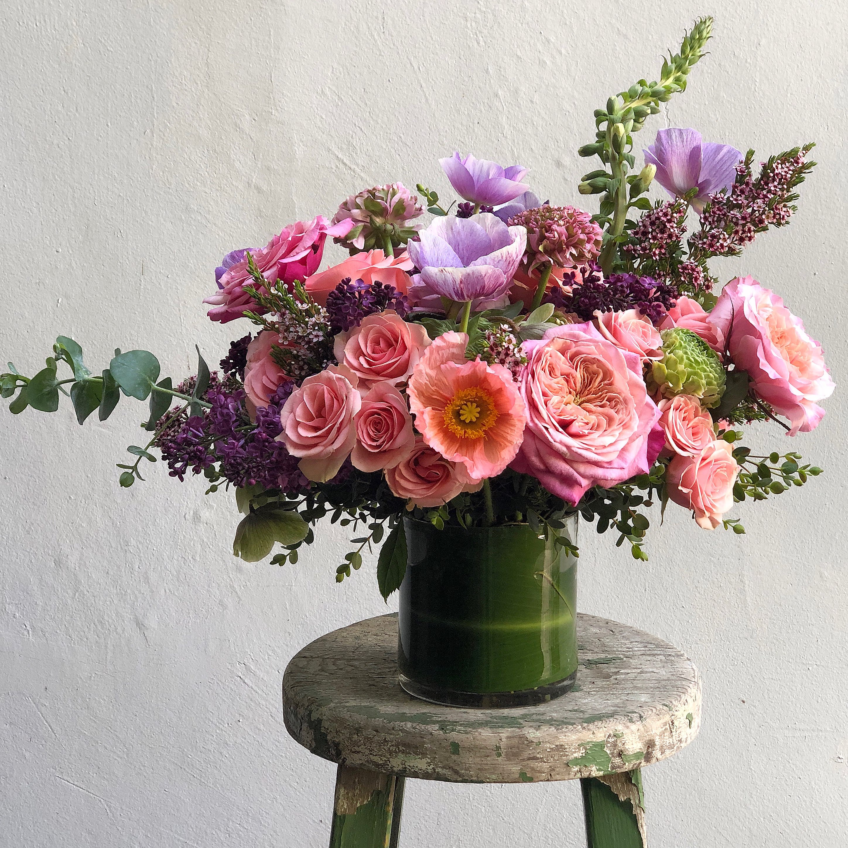 The say Hello to your new, little friend arrangement. The say Hello to your new, little friend arrangement. - The chicest way to send a not-so-overwhelming Arrangement to that Special Someone. Divine City! Note: Seasonal Flowers will be used to replace those not in season. Like Poppies, for example. Regardless, we will stun you.