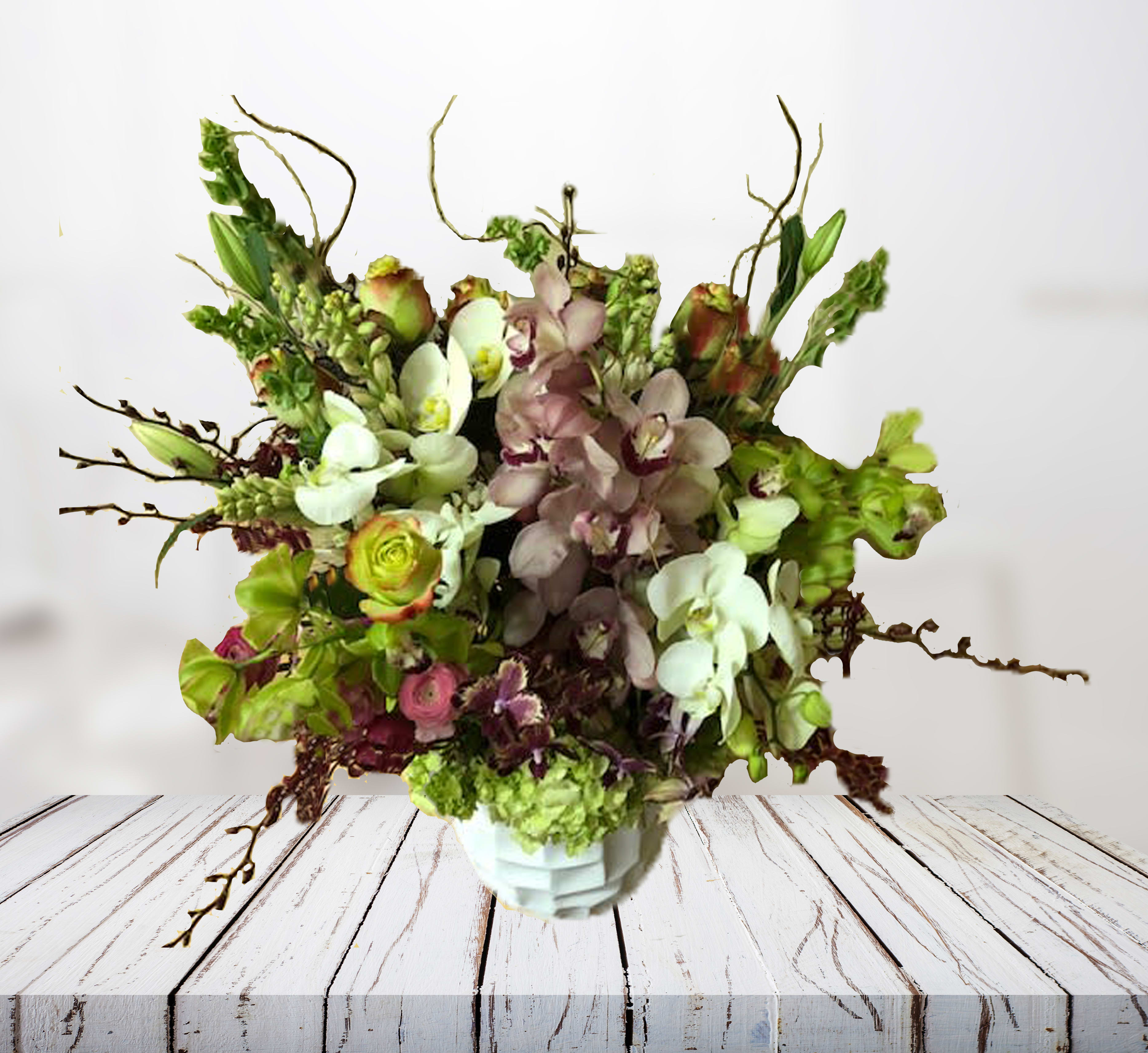 Designer's Choice - Luxurious - The arrangement depicted in the photo is just one example of our Designer's Choice Vase Arrangement. Actual arrangement may vary in terms of flower type, color scheme, and overall design depending on seasonal and local availability - but will be similar in size and include flowers of equal value.  