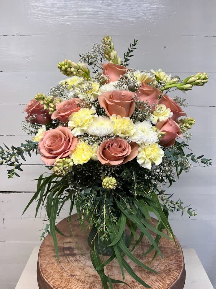 Peaches 'N Cream - Peaches 'N Cream is the most whimsical way to sweeten somebody's day. This beautiful boho arrangement with eucalyptus, peach roses, white chrysanthemums and cream carnations adds a feminine touch to any space.   APPROXIMATE DIMENSIONS: 22&quot; W x 20&quot; H