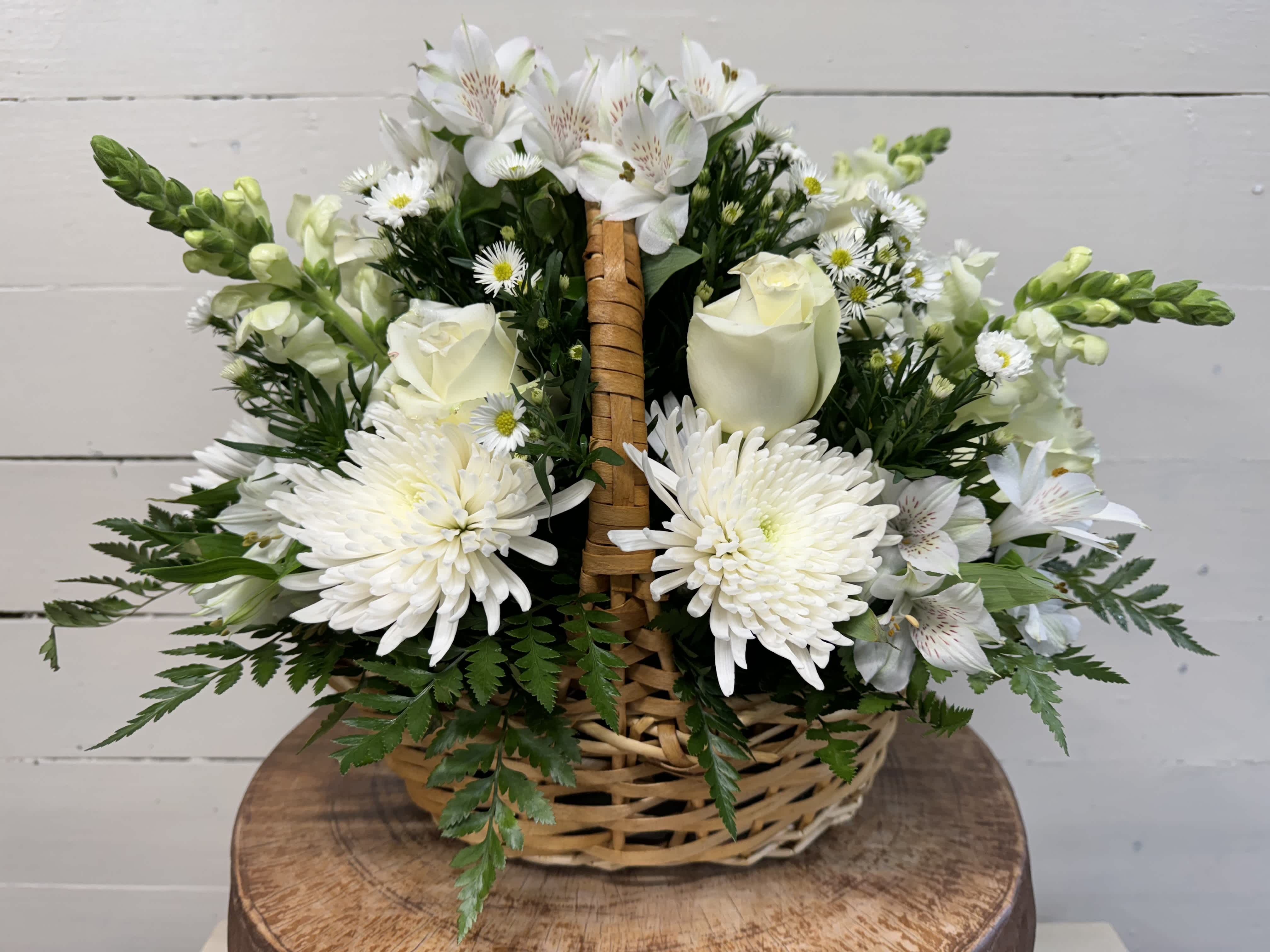 Pure and Pristine Basket - A peaceful white and green basket featuring white mums and white roses with greenery in a basket. Send your sympathies with Pure and Pristine.  Approximate Dimensions: 14&quot;D x 10&quot;H