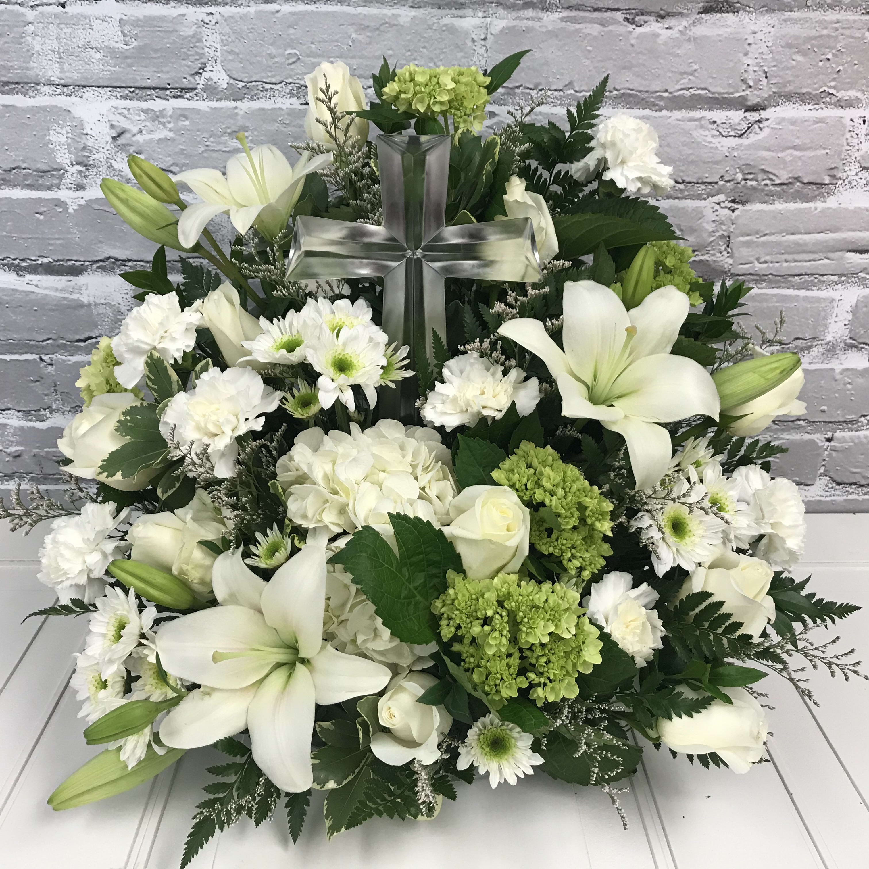 Always Remembered  - Stunning large crystal cross in nestled into the middle of white and light green flowers. This is a large, beautiful keepsake crystal cross. (This is a larger crystal cross than the ones featured in all the other &quot;cross&quot; bouquets) Bouquet measures approximately 18&quot; tall and 22&quot; wide. Very full and beautiful!!
