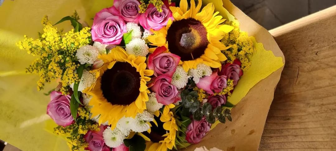 Wrapped bouquet, Just for mom - Lavender roses  ( 2 toned) solidago, sunflowers, white buttons. spiral eucalyptus. (no vase included for this design.