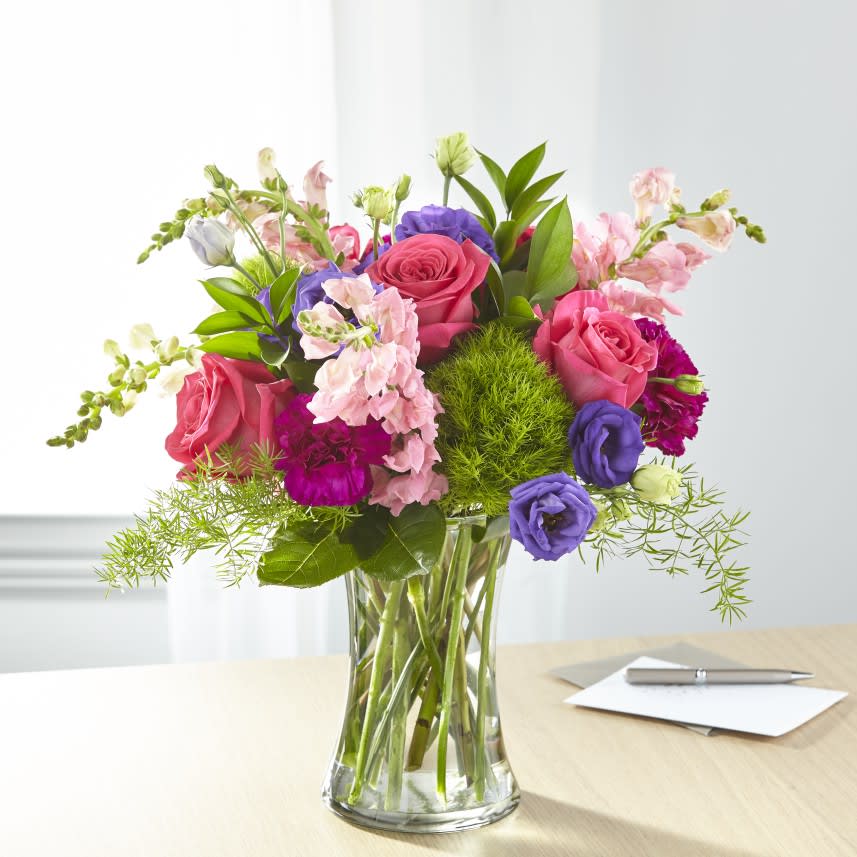 Charm & Comfort Bouquet Charm & Comfort Bouquet - Charm and comfort are evoked though a refined array of bright roses, lisianthus and snapdragons.