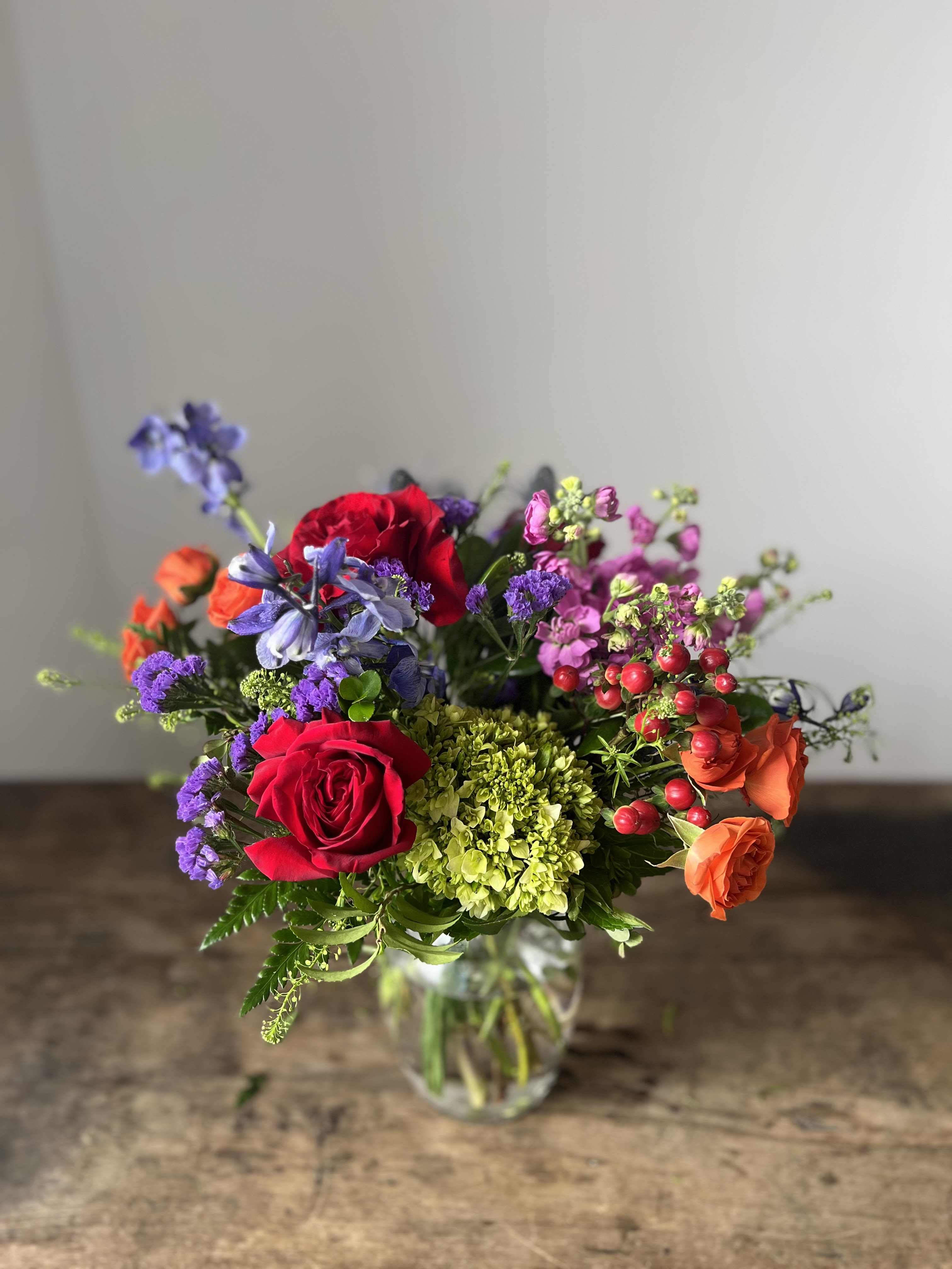 Joyful Jewel Tones - This arrangement is packed with vibrant colorful blooms to bring joy to most any occasion.