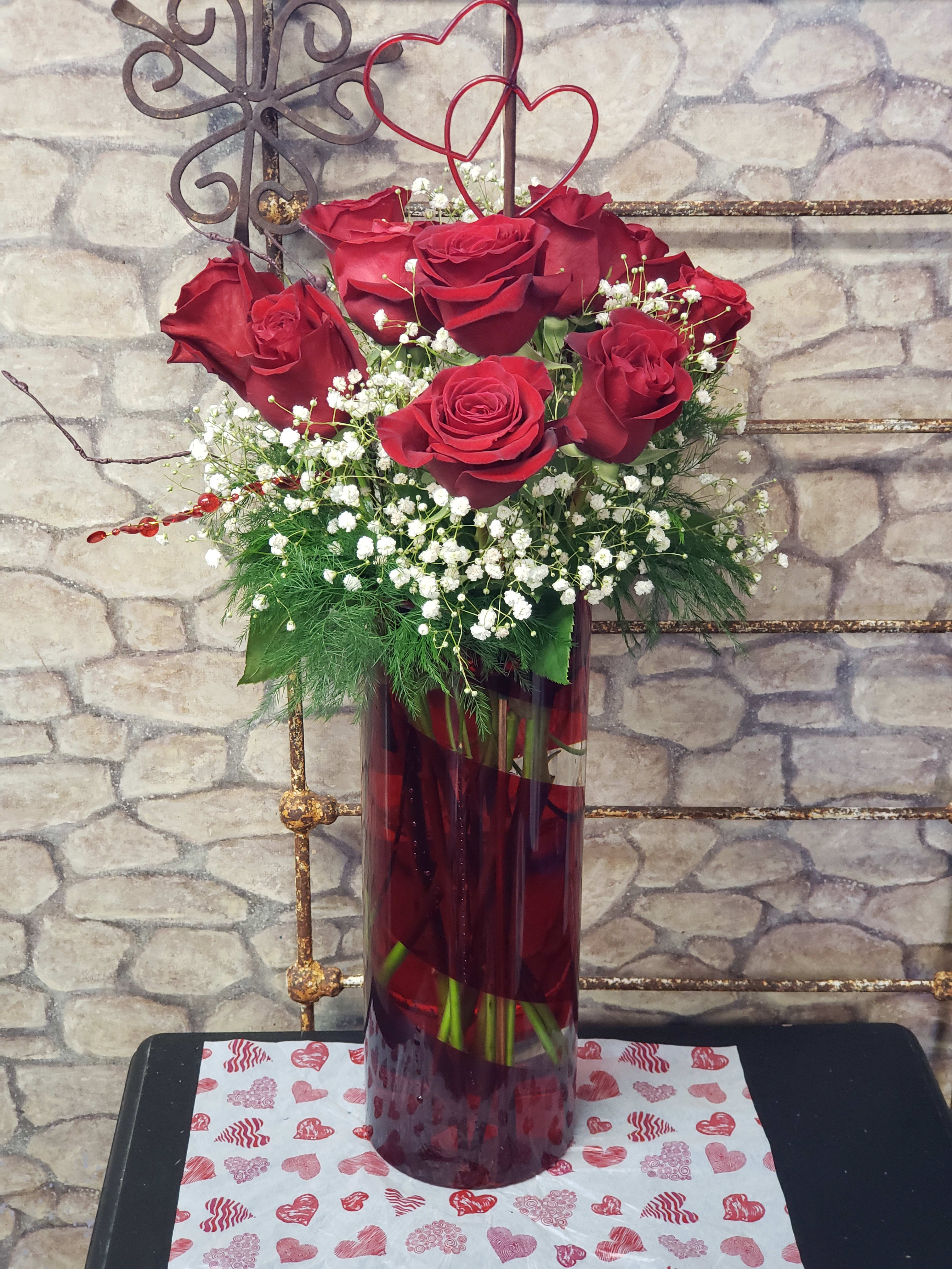 Romeo &amp; Juliet  - This show stopper of a design &amp; Keepsake glass vase will make a statement. LIMITED!  Standing 15-18&quot; tall,  of pure romance with Rose's, a dozen 50-60 CM Freedom Rose's, Gyp, mixed greens. The cylinder style glass vase swirls with ruby red hues. Two gifts in one! Valentine with love!
