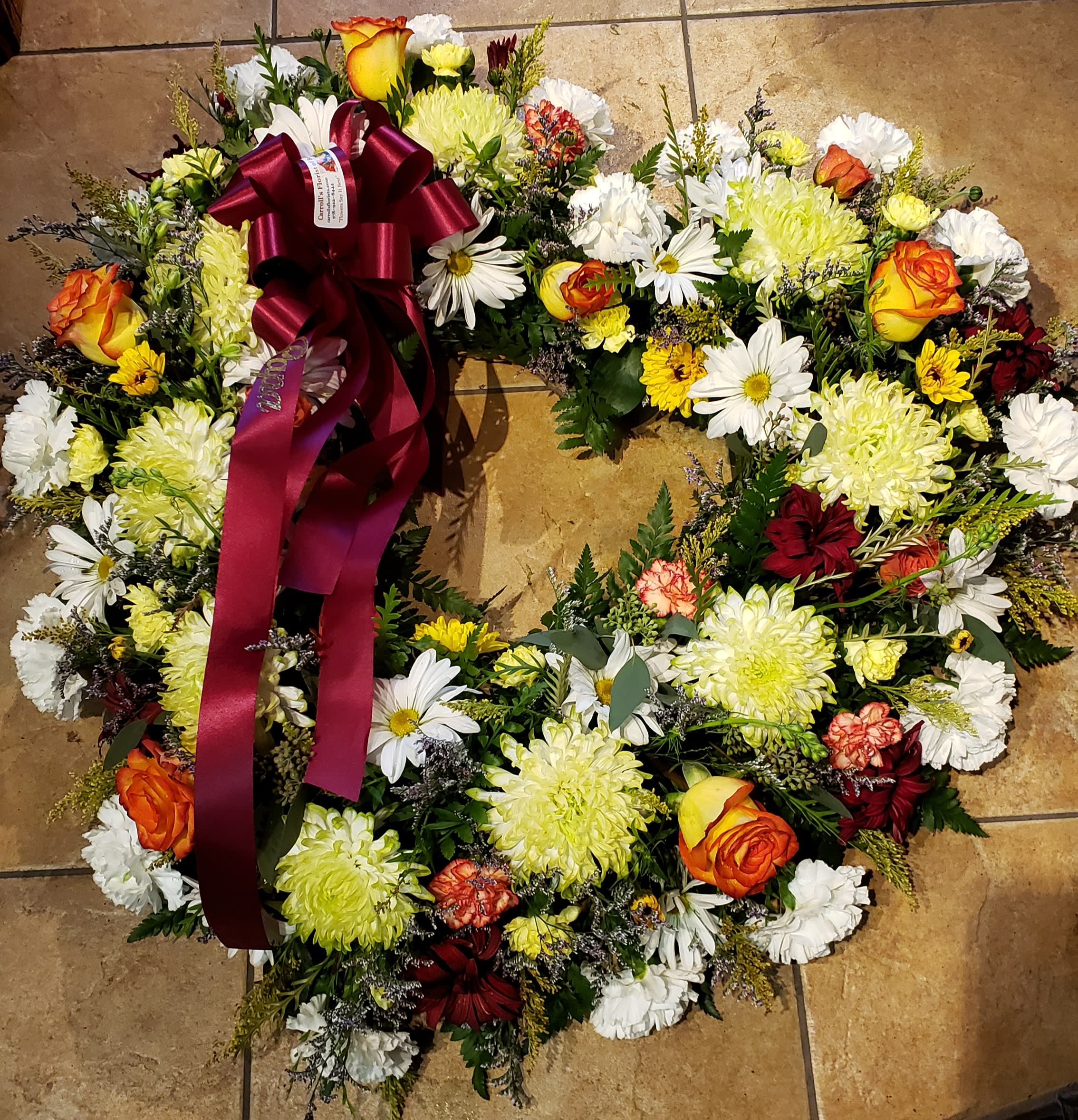 Autumn Heart Autumn Heart - Standard design mix with roses...bow & script. Photo sample for shape & size only....flowers & roses can vary in color based on market fresh inventory at time of order...Allow 24-48 hour design & delivery notice... Let us know a couple of color themes you might like.
