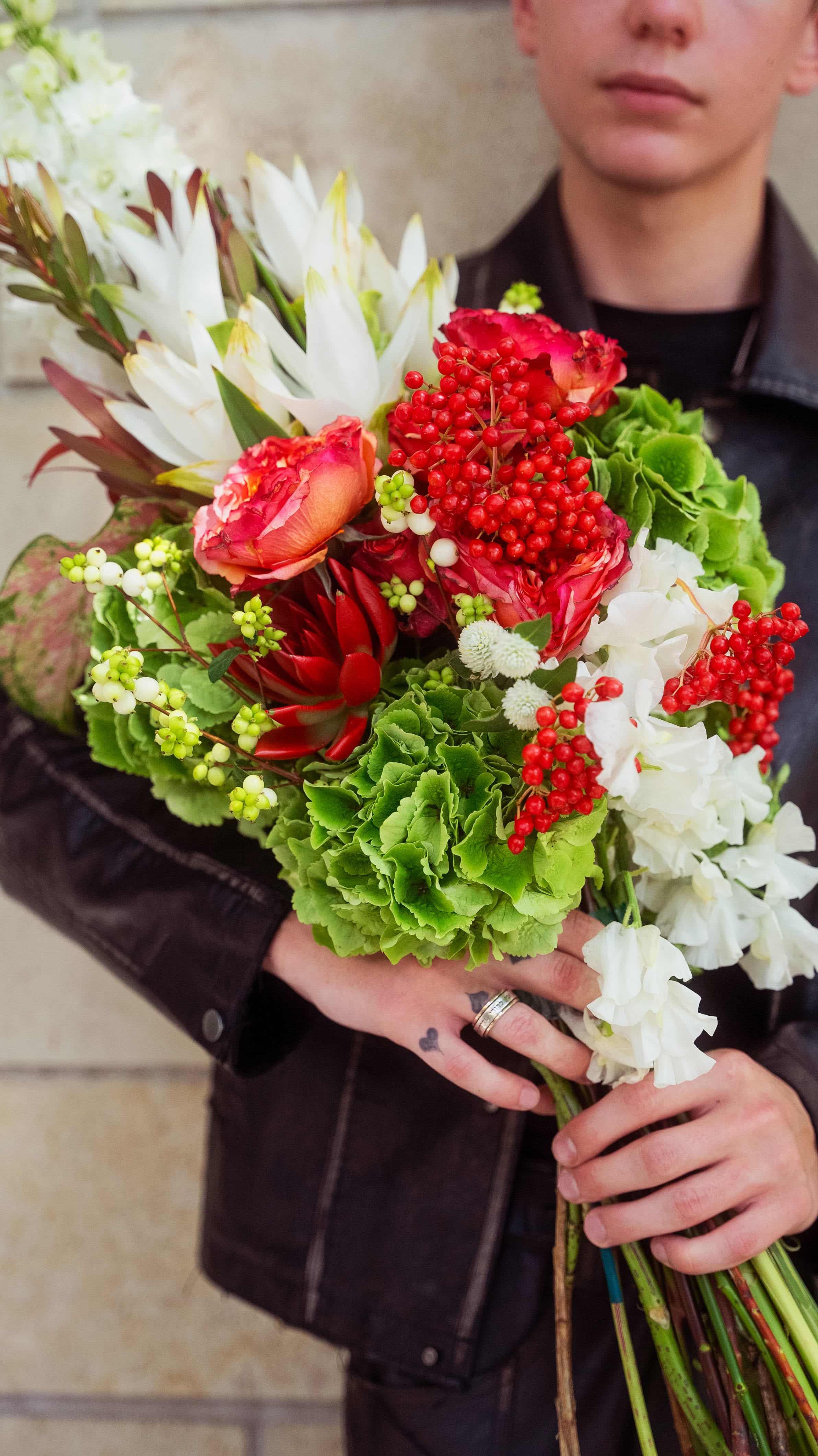 №104 Winter Berry Bliss - The Winter Berry Bliss bouquet is a festive arrangement that combines rich textures and a vibrant winter color palette, ideal for seasonal celebrations or holiday decor. With its blend of colors and textures, this bouquet evokes the essence of winter, combining natural elegance with a touch of festivity. Perfect for adding seasonal charm to any space or as a thoughtful holiday gift.