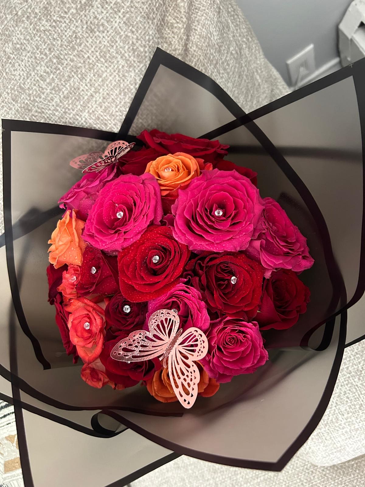 Mixed color roses bouquet - Mix color roses bouquet that will be wrapped in black with rhinestone pins and butterflies for a wow effect.