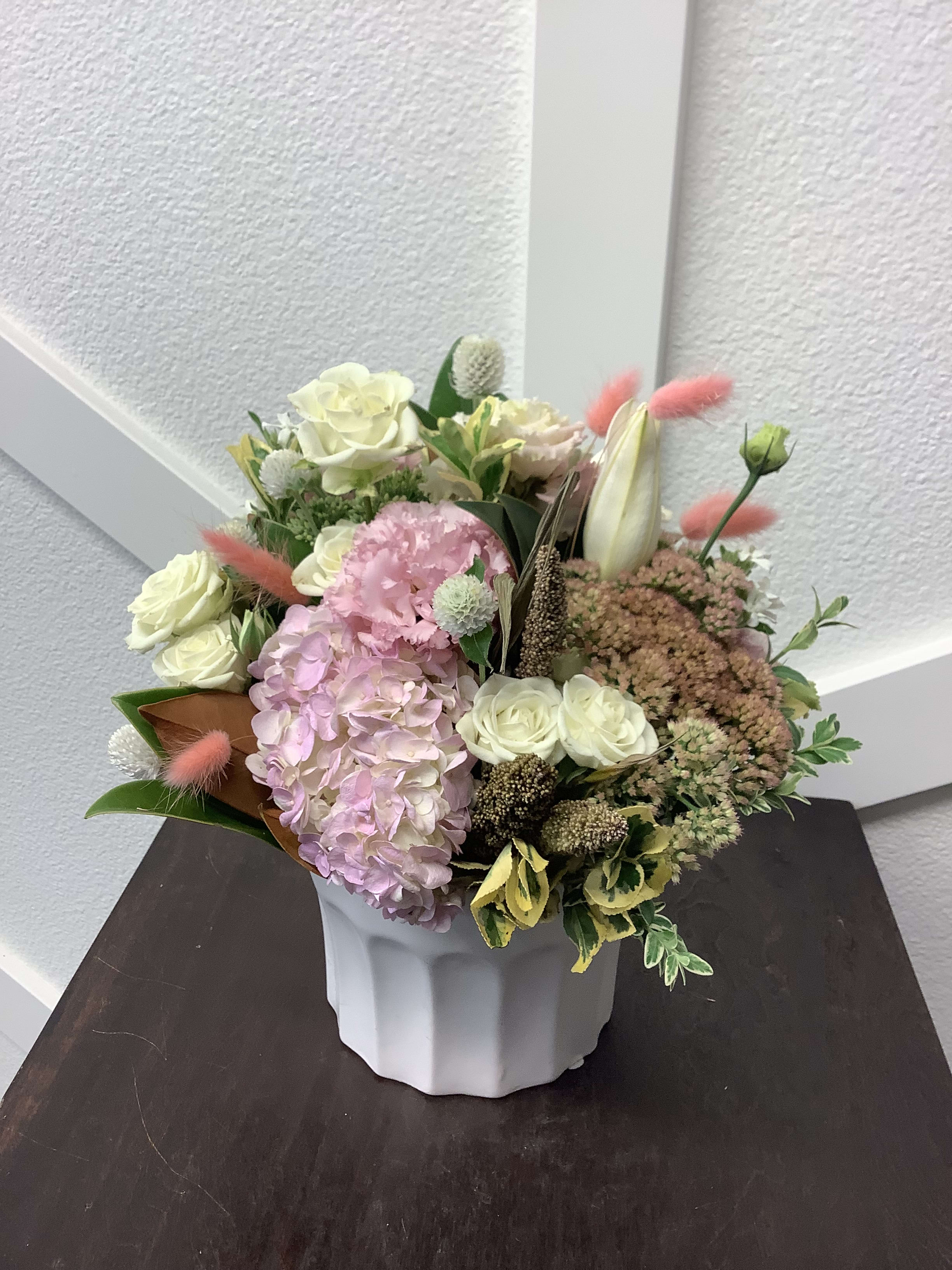 Peachy Pink Farmhouse Bouquet - This beautiful arrangement is a great color palette of mixed pinks, peaches and whites.  A rustic but clean style, combined with the soft pastels all in a white custom made ceramic container. Perfect pick me up! 