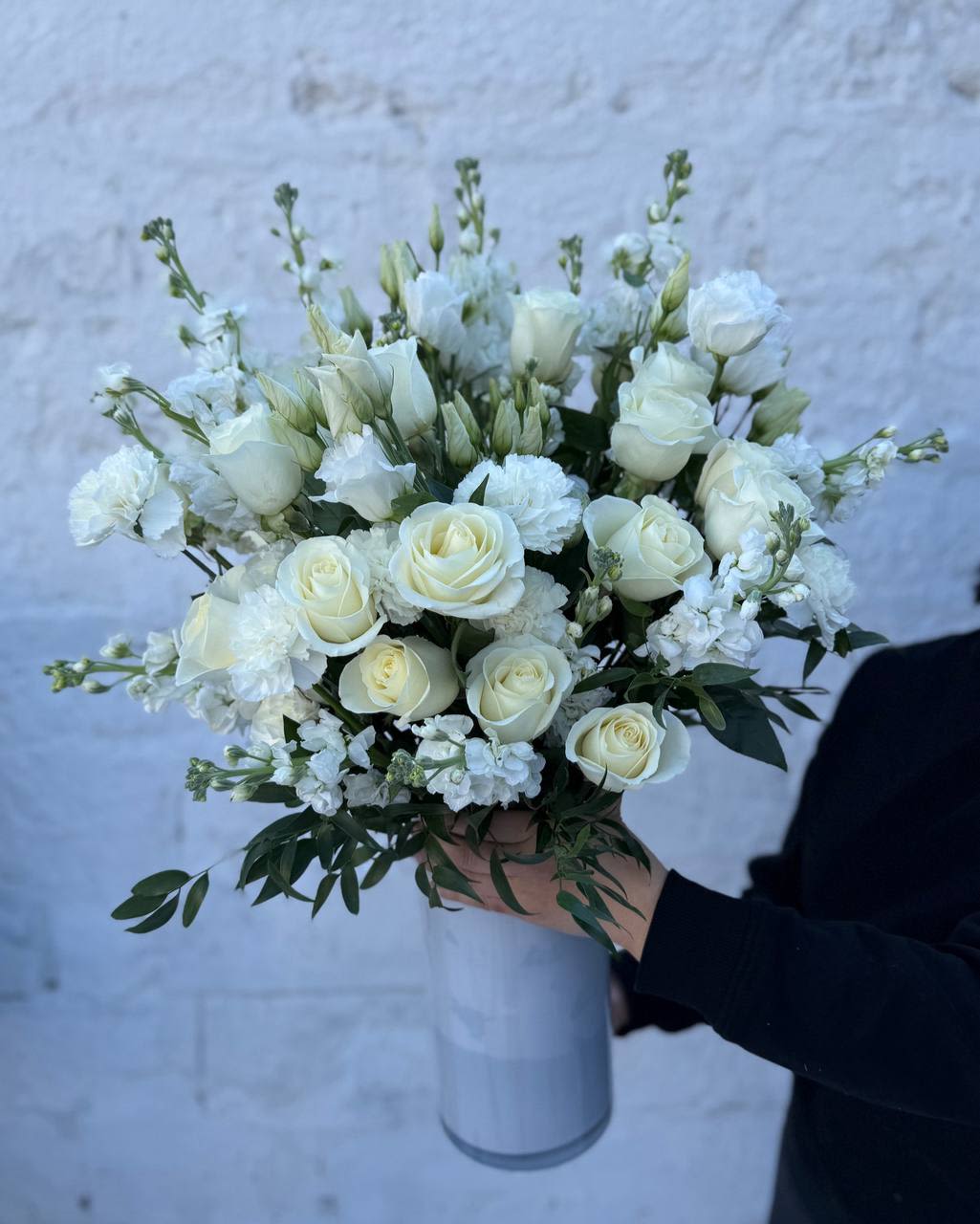 #116 White Soft Luxe - An elegant mix of white flowers in a tall white vase—a classic that never goes out of style. Its lightness, purity, and sophistication make this bouquet perfect for any occasion. 