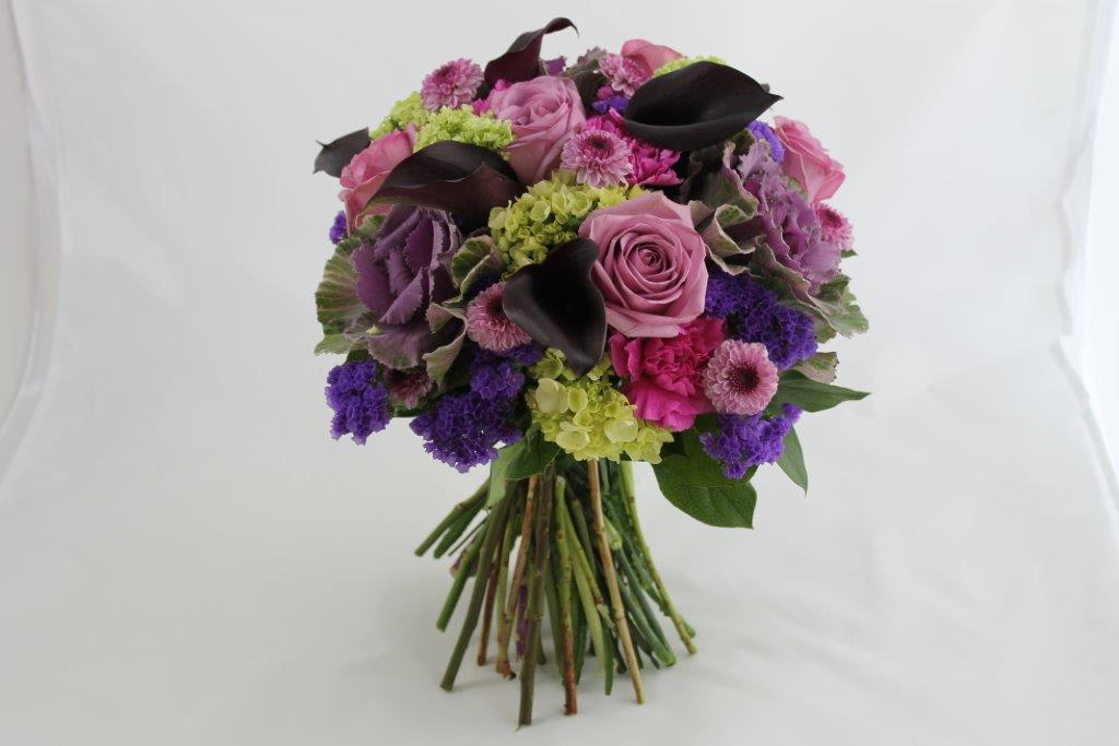 Monets Garden Bouquet - This exquisite bouquet features purple Kale at it's heart along with lavender Ocean Song Roses and purple Paco mini Calla Lilies.  This unique combination is sure to impress you friends and loved ones leaving them with warm thoughts of you as they cherish your gift for days to come.
