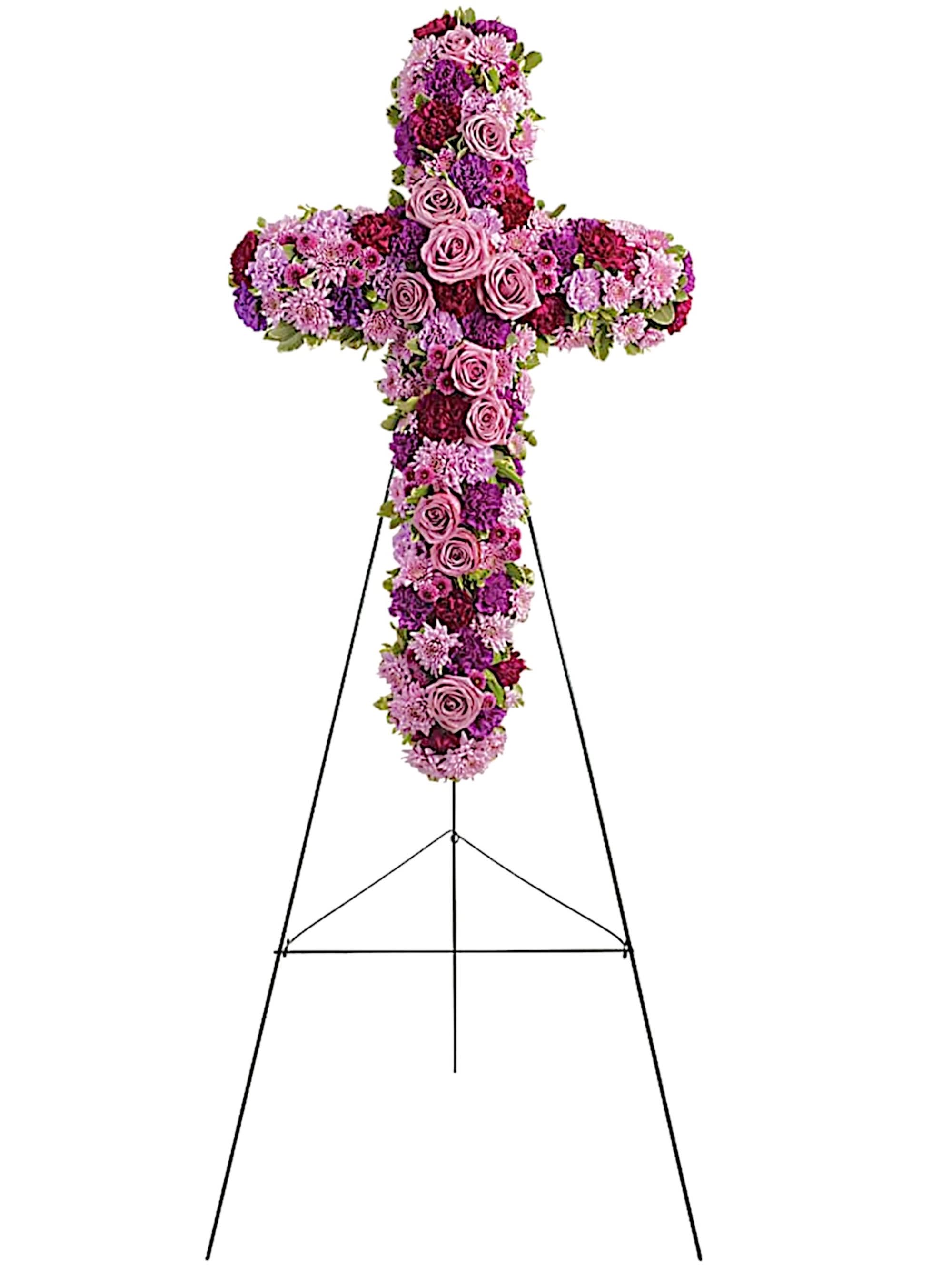 Deepest Faith - Standing Cross - A breathtaking standing cross of majestic purple and lavender blooms remembers and honors the departed with a meaningful and moving expression of faith, admiration and divine love.  DETAILS Gorgeous blooms such as lavender roses and carnations, and chrysanthemums of lavender and deep purple create a religious display ideal for a funeral or memorial service. A grand display appropriate for the funeral home, memorial service, or gravesite.  EASEL INCLUDED Orientation: One-Sided *If you would like to add a ribbon with a sentiment for an additional $10 each. Item #NF-1106  FLORIST-TO-DOOR Same day flower delivery on most orders placed online by 12 pm or 10 am on weekends PST.  BLOOM DETAILS Roses  Carnations Cushion-Mums Button-Mums Greenery  The Standard Arrangement is approx. 38&quot;H x 23&quot;L without stand (SHOWN) The Deluxe Arrangement is approx. 42&quot;H x 27&quot;L without stand The Premium Arrangement is approx. 46&quot;H x 31&quot;L without stand  INSTRUCTIONS: 1.) Please have the business name of the funeral home, address &amp; phone number. 2.) Please have the first name &amp; last name of the deceased. 3.) Please have the start time of the services. 4.) If you would like for us to write a brief message on a small business card-size note, please have your message ready.  NINFA'S FLOWERS 2405 WHITTIER BLVD. LOS ANGELES, CA. 90023