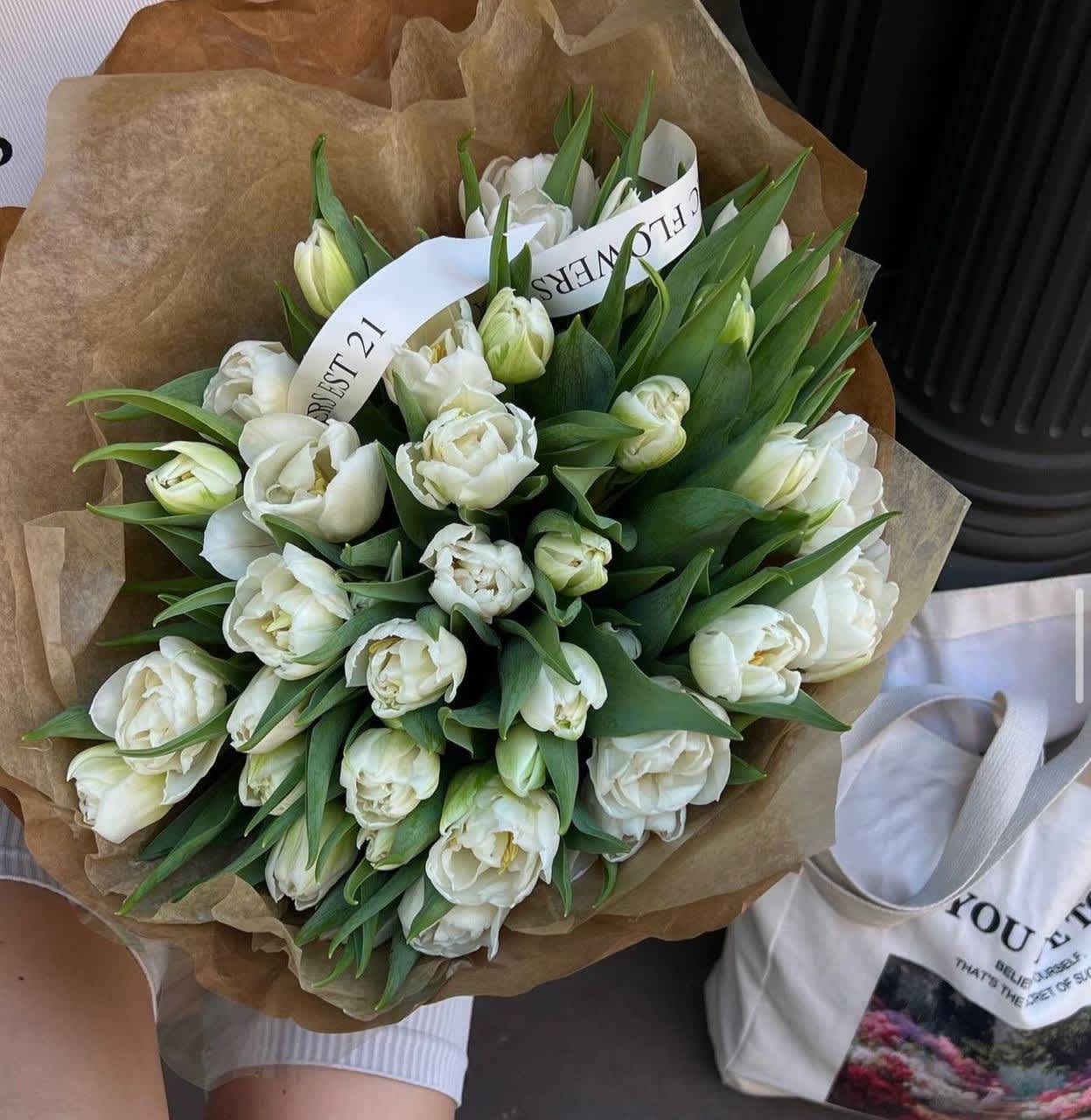 #106 Vintage Kraft Bouquet - A bouquet of white tulips in kraft paper is an elegant and restrained composition that emphasizes the purity and tenderness of spring. Perfect for sophisticated and stylish gifts.