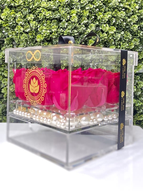 Eternal Roses Acrylic Box (9 Roses) - Hot Pink - Eternal Roses Acrylic Box (9 Roses): We stopped the clock for our preserved roses to experience our Eternal Deluxe Collection timelessly. 9 preserved roses decorated in our signature deluxe clear acrylic boxes and completed with a bow and a personalized card message, trendy and fancy. Roses that Last 3 years. *Avoid direct sunlight, dust, water or excessive heat. *Available for Nationwide Shipping (5-7 days shipping time)