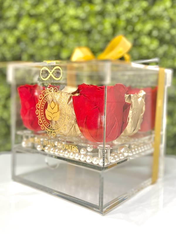Eternal Roses Acrylic Box (9 Roses) - Gold/Red - Eternal Roses Acrylic Box (9 Roses): We stopped the clock for our preserved roses to experience our Eternal Deluxe Collection timelessly. 9 preserved roses decorated in our signature deluxe clear acrylic boxes and completed with a bow and a personalized card message, trendy and fancy. Roses that Last 3 years. *Avoid direct sunlight, dust, water or excessive heat. *Available for Nationwide Shipping (5-7 days shipping time)