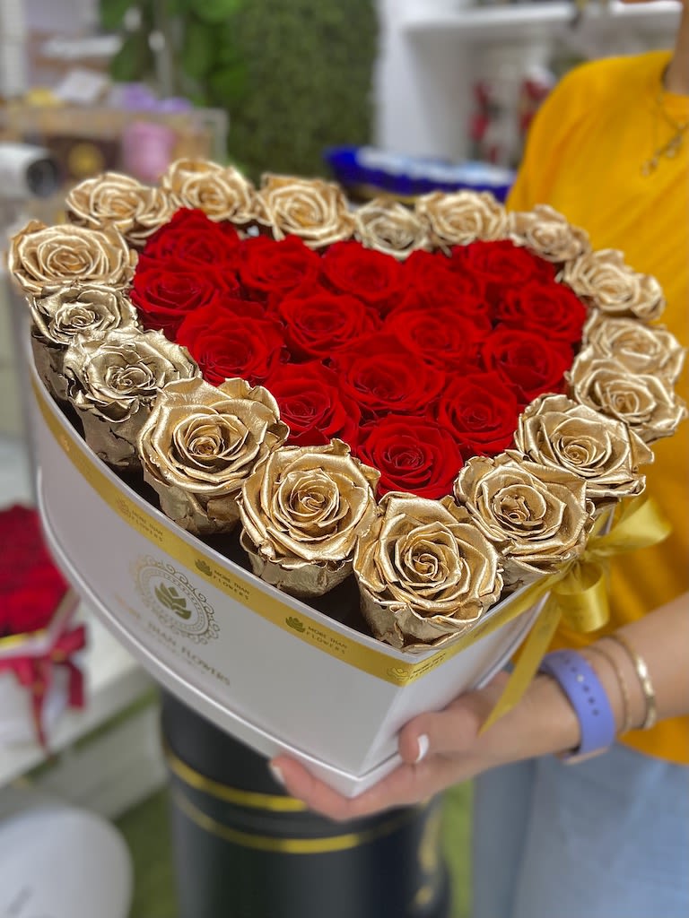 Heart Box Eternity Roses - White Box, Gold/Red - Heart Box Eternity Roses: We stopped the clock for our preserved roses to experience our Preserved Deluxe Collection timelessly. (32-34 X Large Eternal roses approx.) decorated in our deluxe heart shape boxes L11 x 7H completed with a bow and a personalized card message, trendy and fancy. Roses Last up to 3 years. *Avoid direct sunlight, dust, water or excessive heat. *Also available for Nationwide Shipping (5-7 days shipping time)